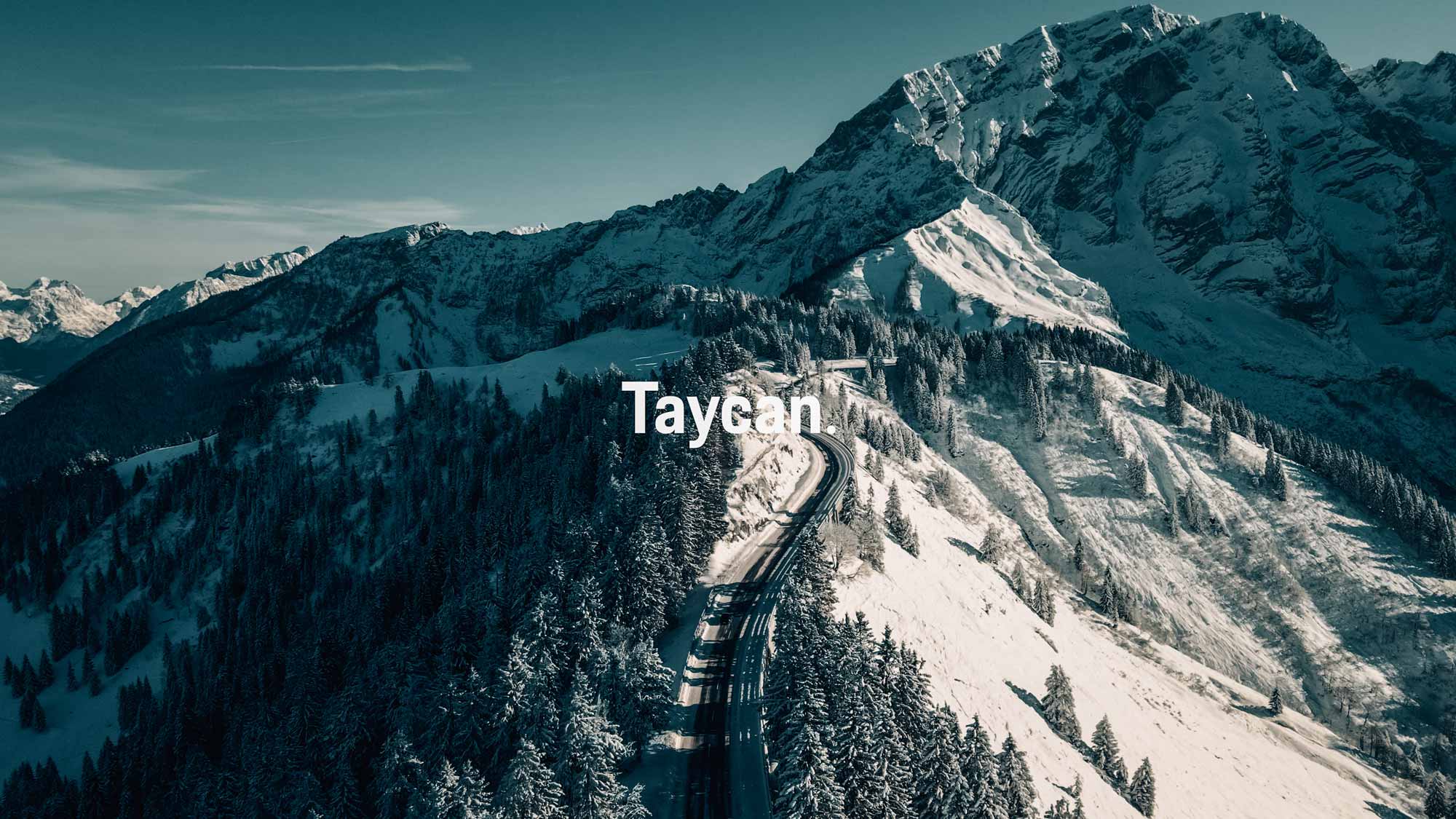 Aerial view of a car on a snowy mountain road, captured with an FPV drone for a strategic filmproduction campaign for Porsche