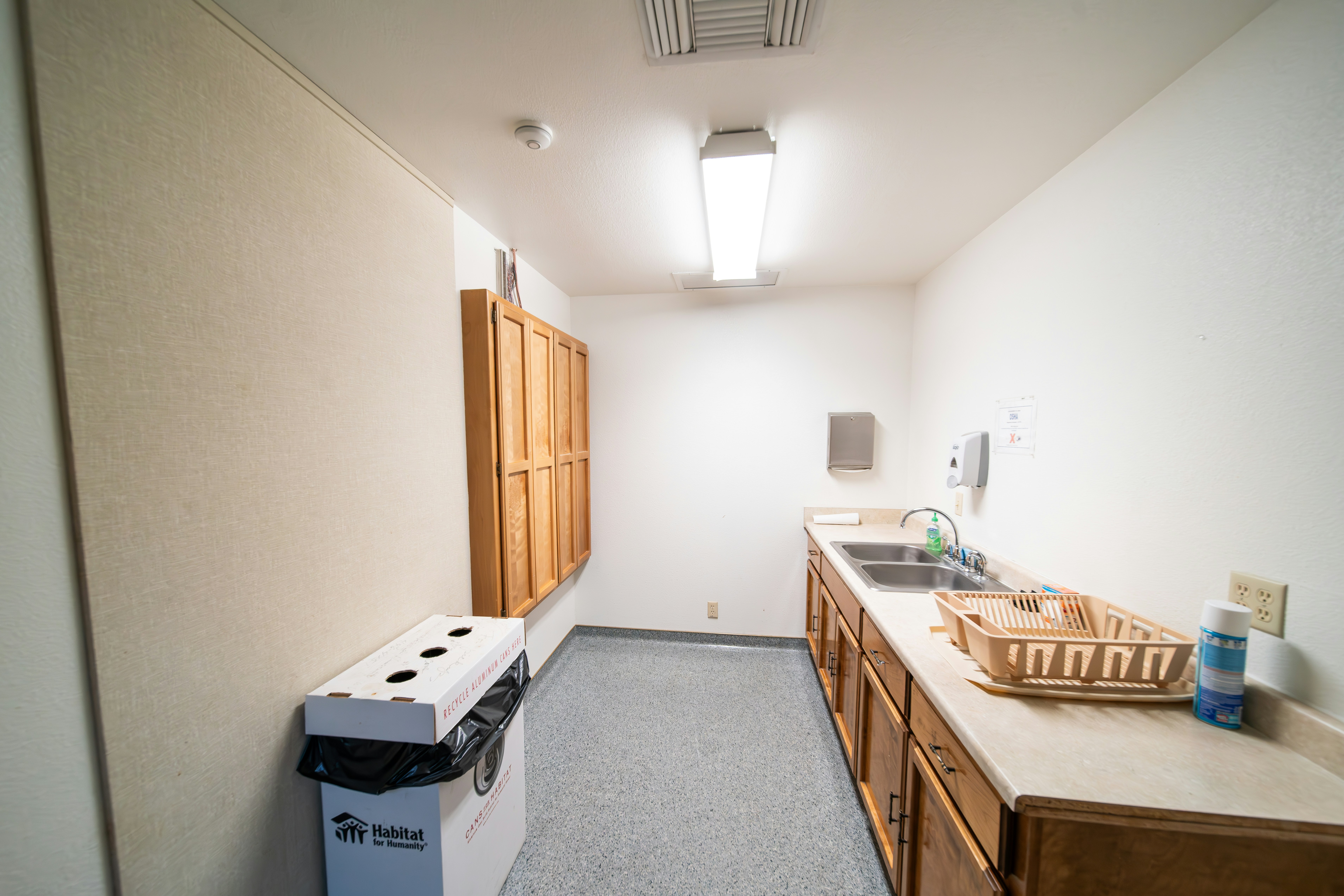 a kitchen with a sink and a refrigerator