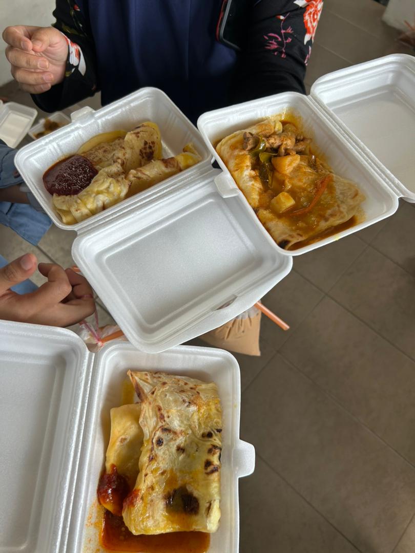 Close-up of Malaysian Roti Canai or Murtabak served with curry and sambal during the Deepavali team tea break.