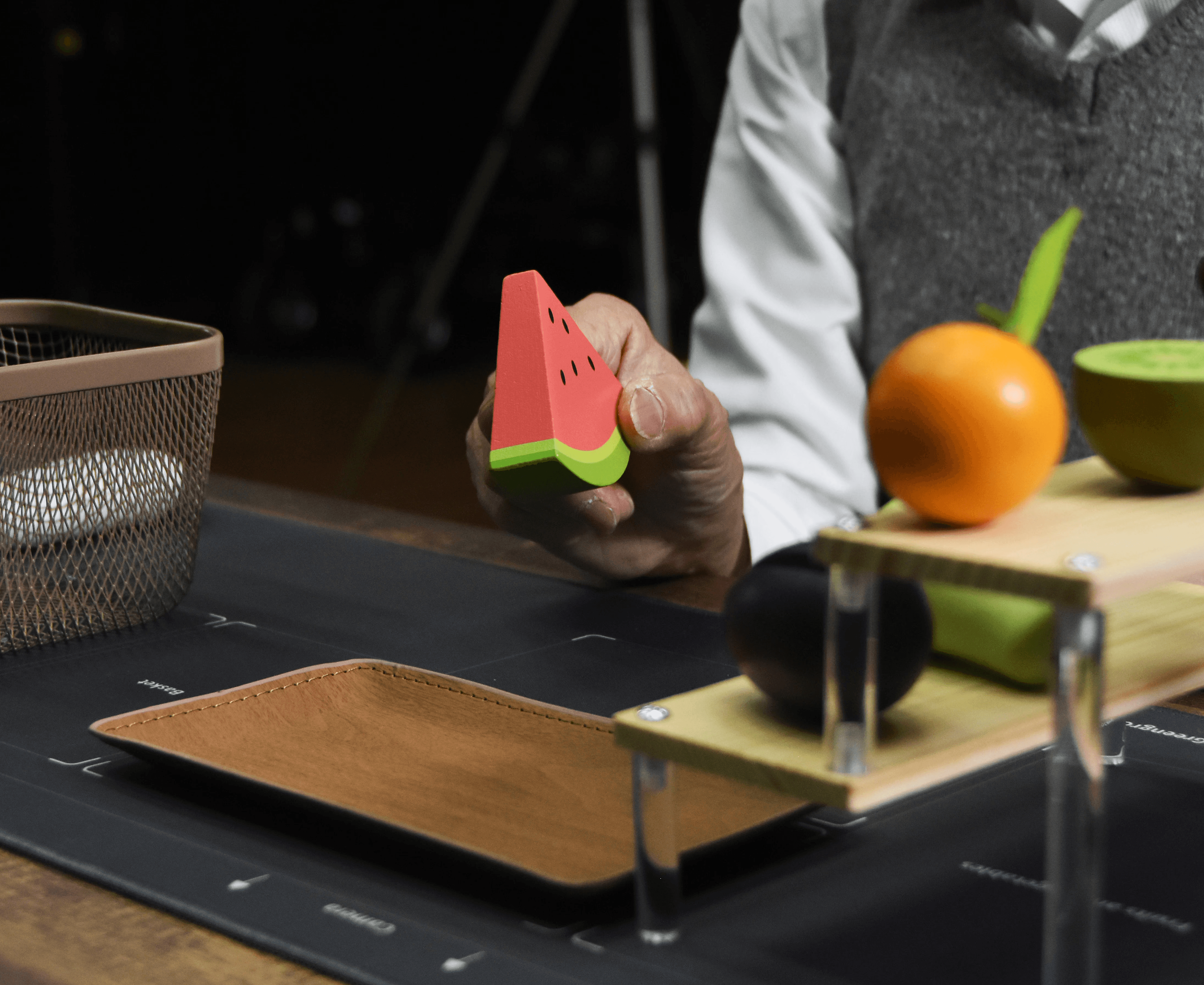 The patient follows the prompts from Brainmate's MindVoyage to grasp and move the props for cognitive therapy.