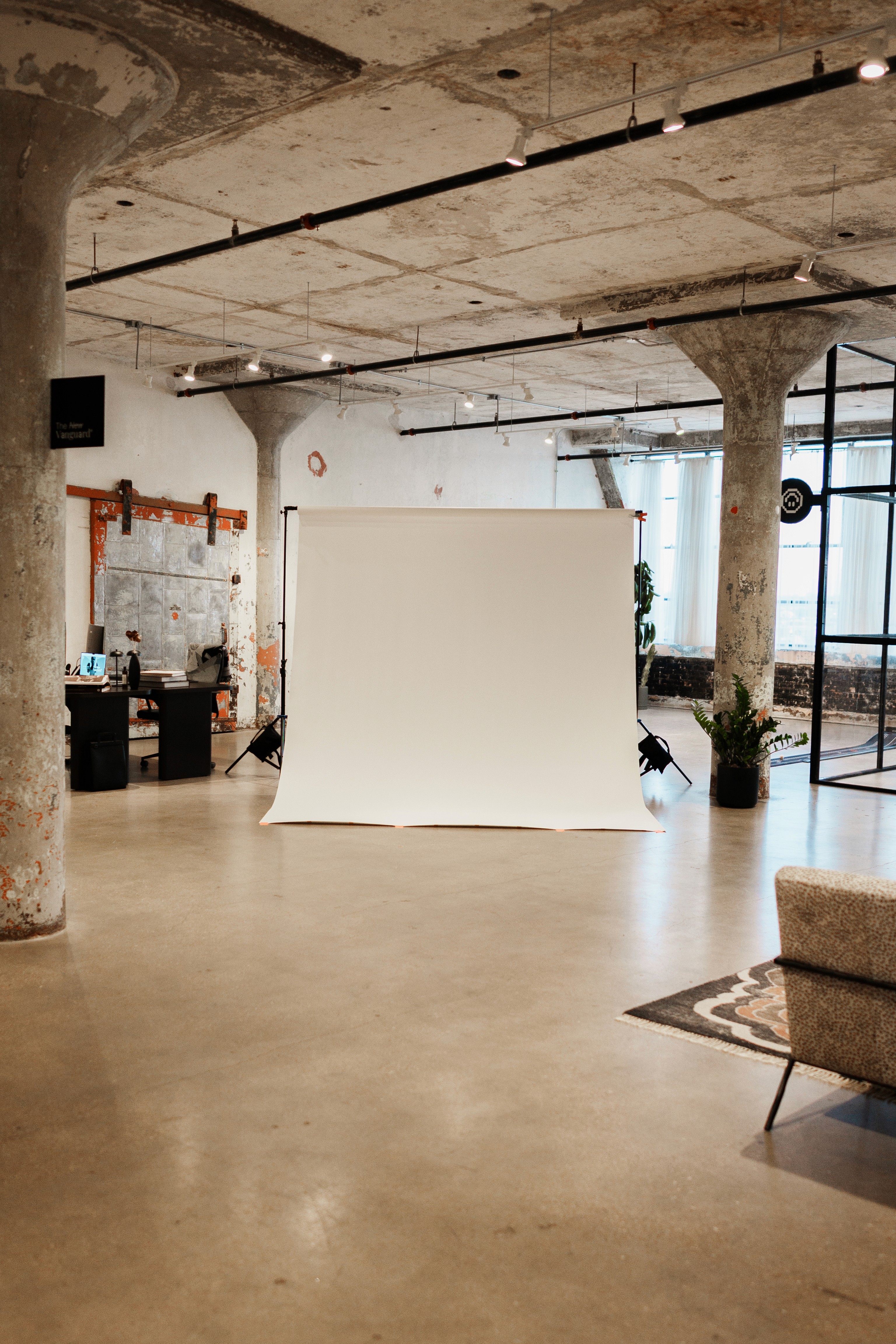 Wide shot of studio with white backdrop in the center 