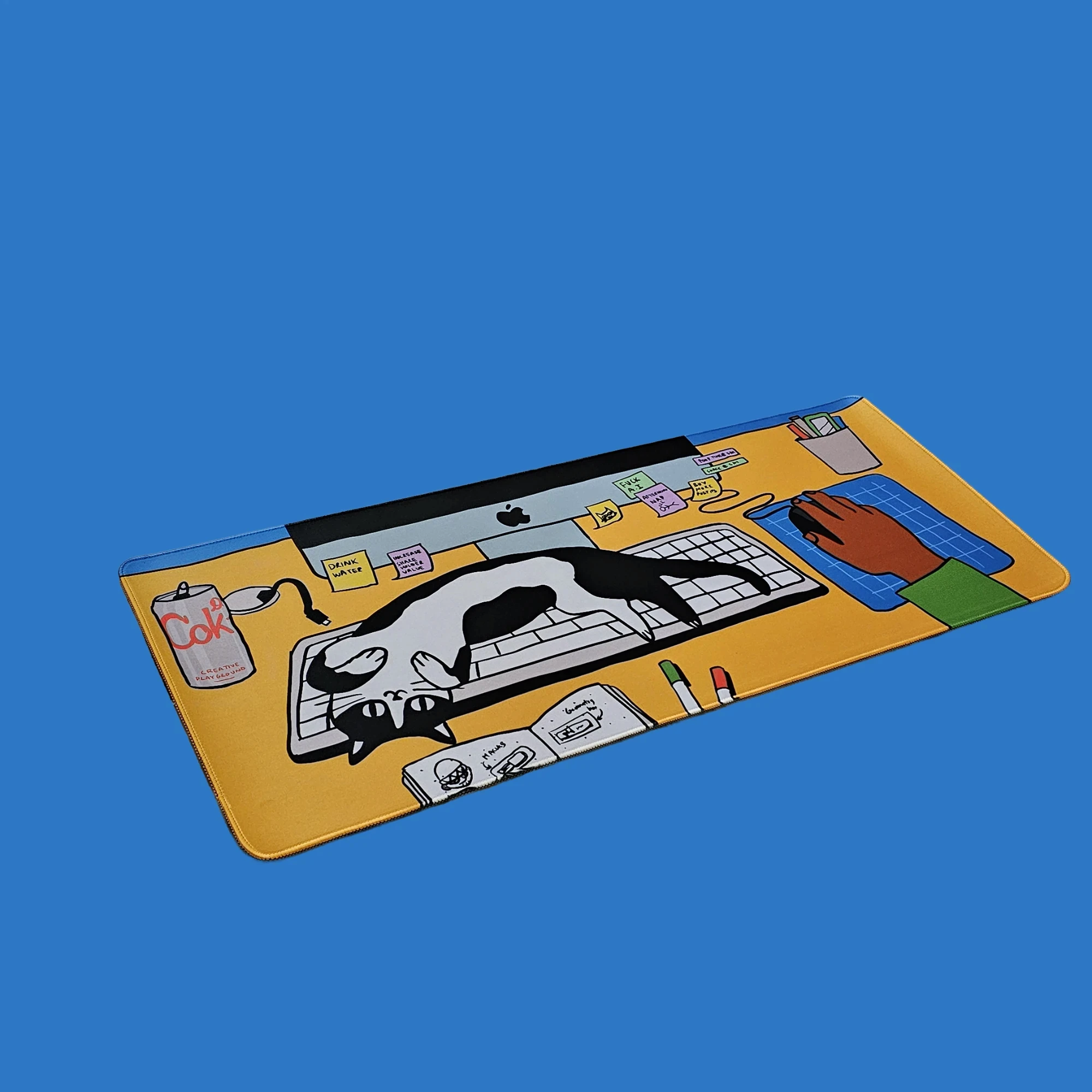 Desk Cat deskmat on a blue background
