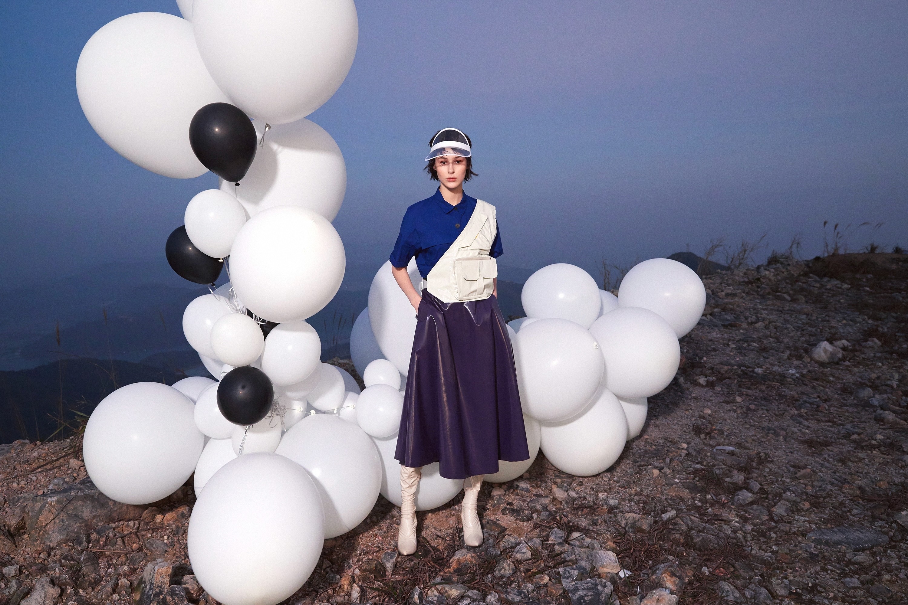 Young black woman witting at the table working on a laptop