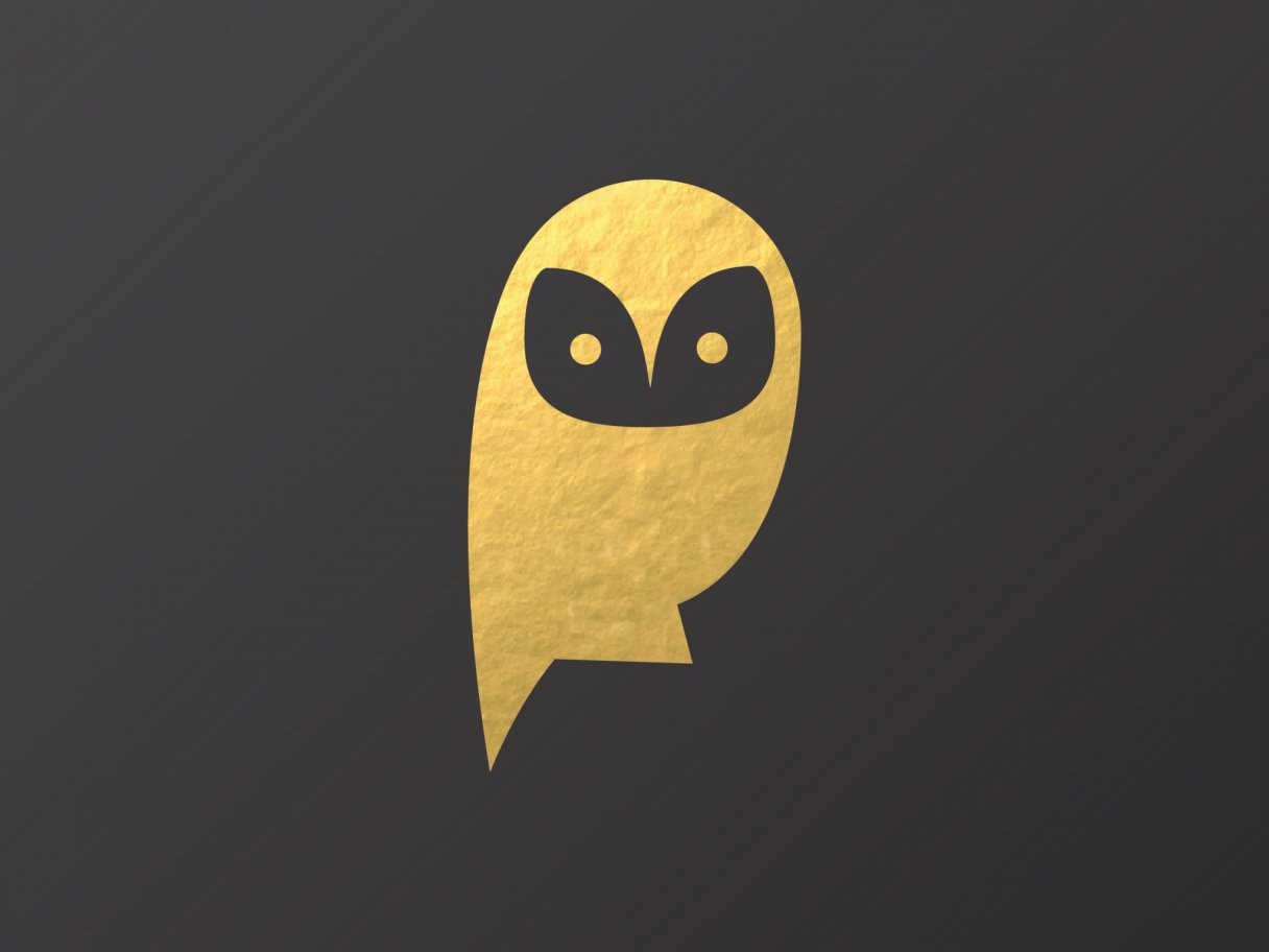 Rustic cabin in a golden field at sunset