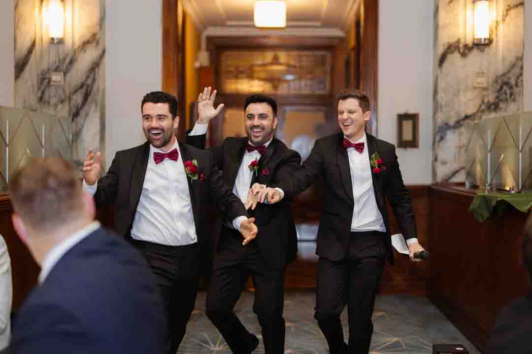 Groomsmen entering reception