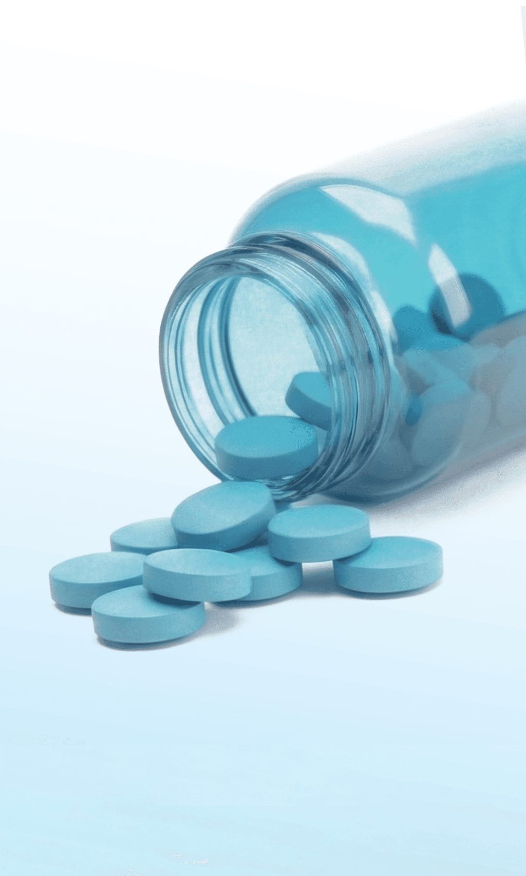 Close-up of a tree stump showing growth rings and a textured brown wood surface.