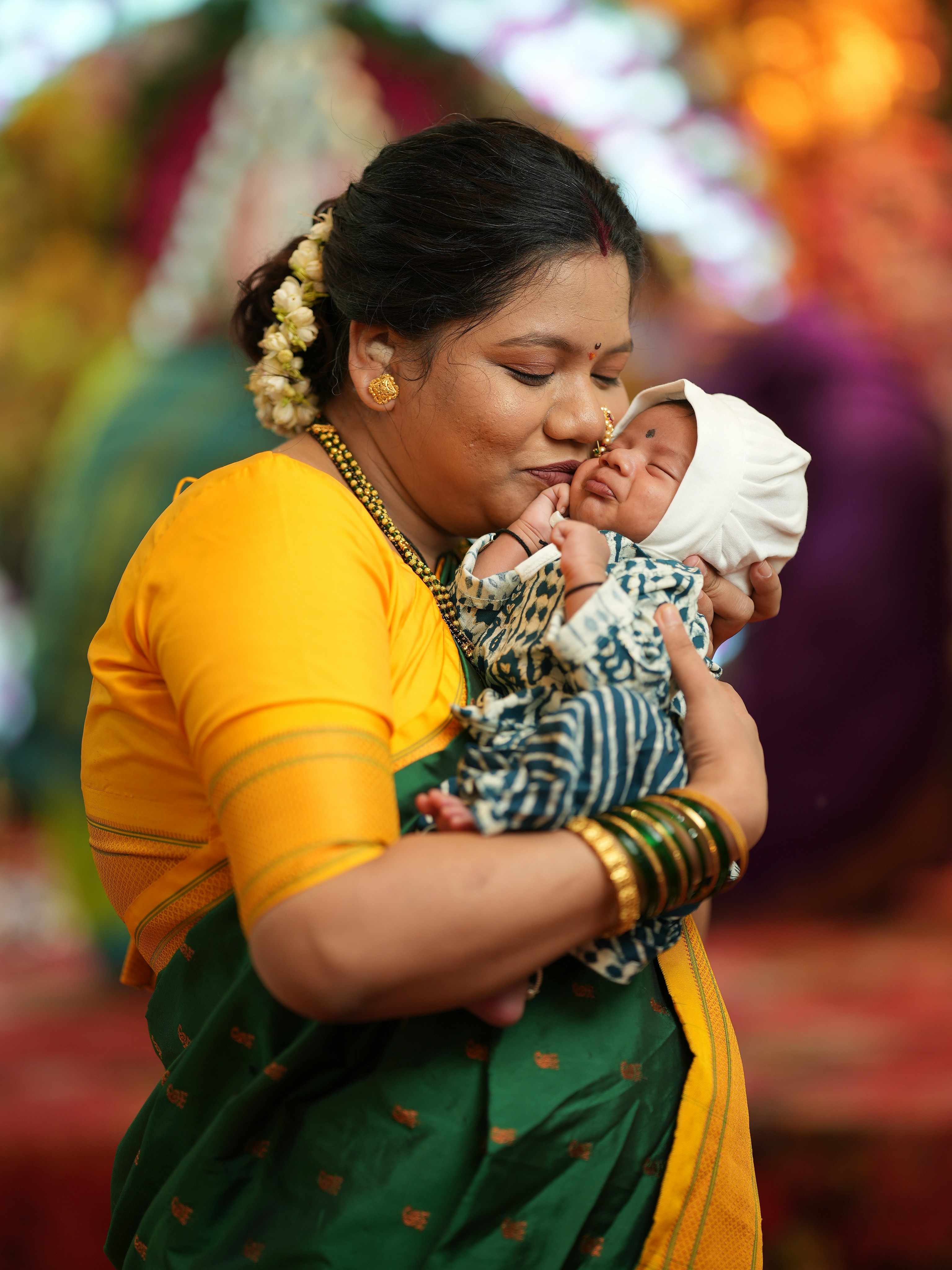 A woman holding a baby in her arms