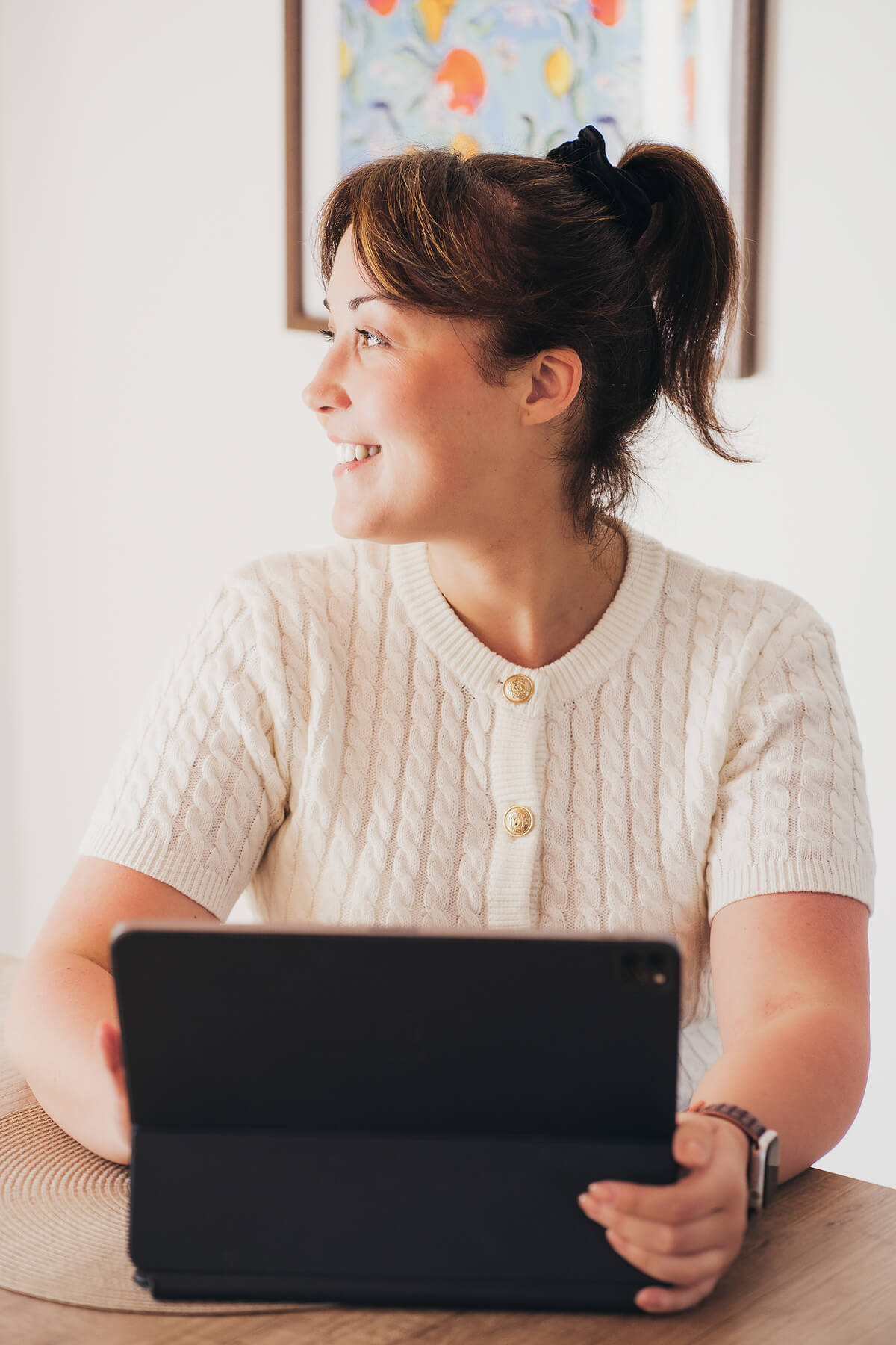 Aniko Rucz working on short-term rental systems, sharing real-world hosting knowledge from hands-on experience