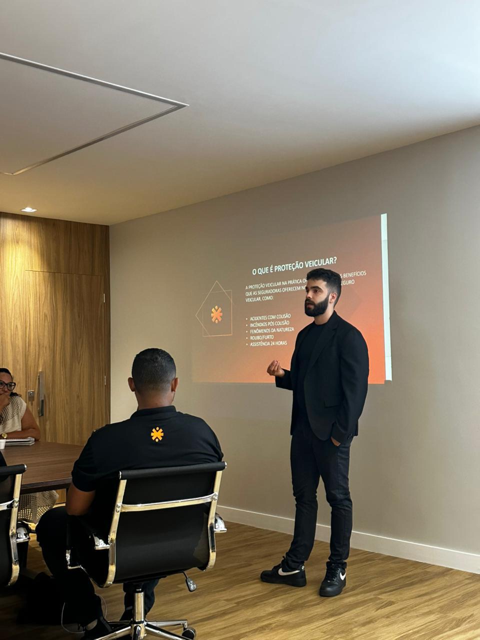 person sitting in a chair in front of a man