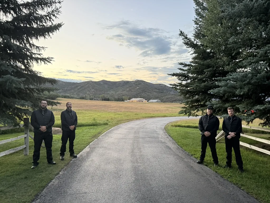 Cameron James Group protective team on a private estate drive near Aspen at dusk