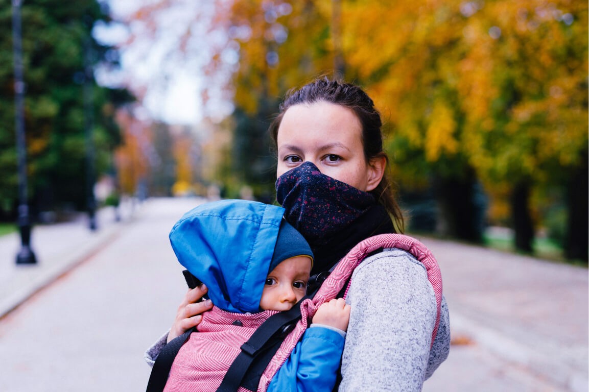 COVID fall autumn winter mother baby black face mask park trees