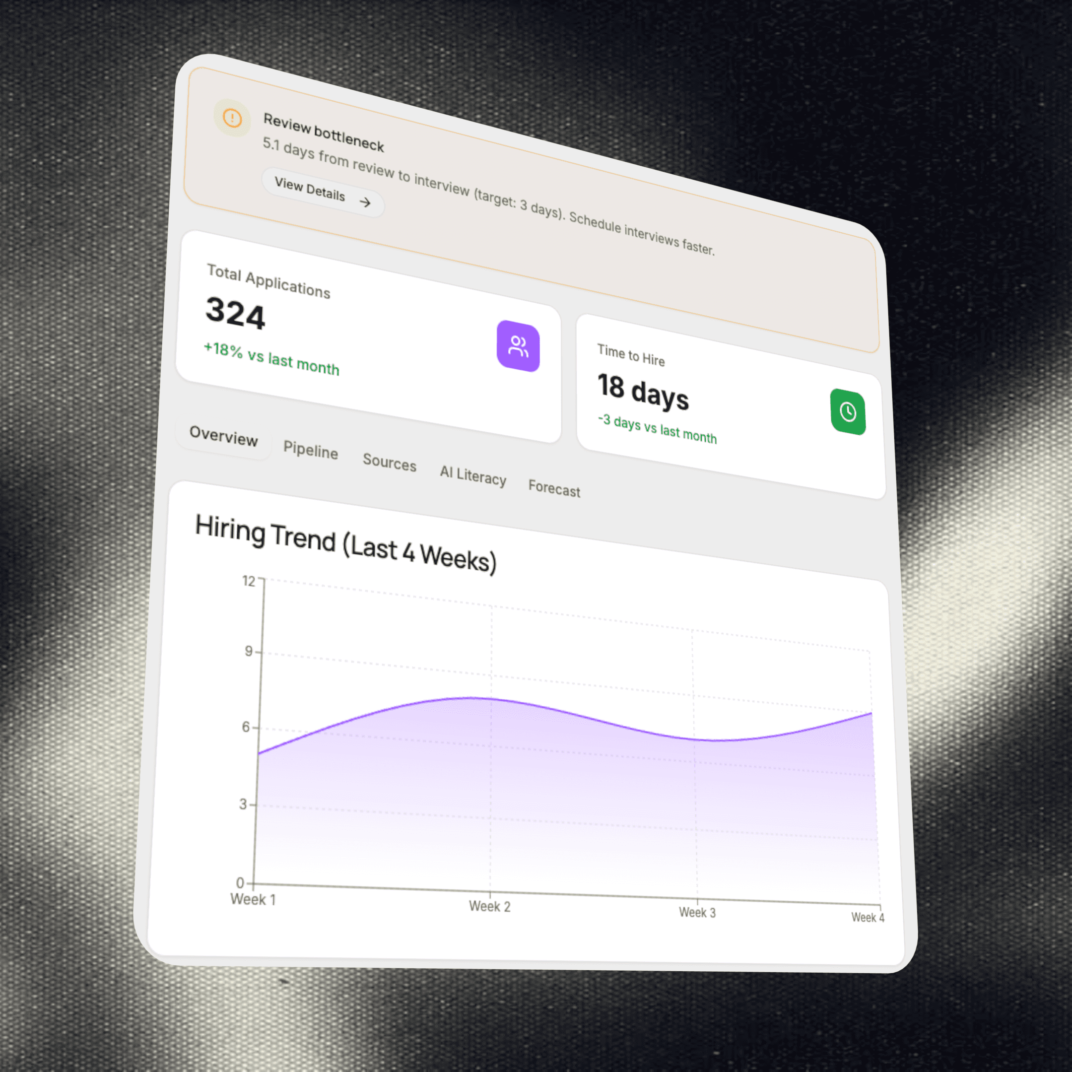 A smiling man wearing glasses in an office setting.