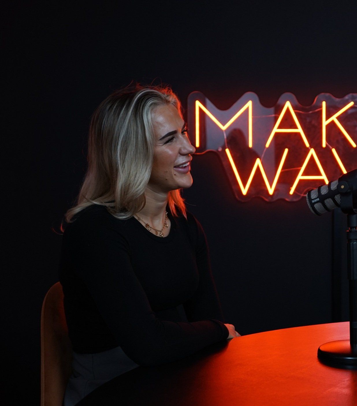 a man holding a wallet and a watch