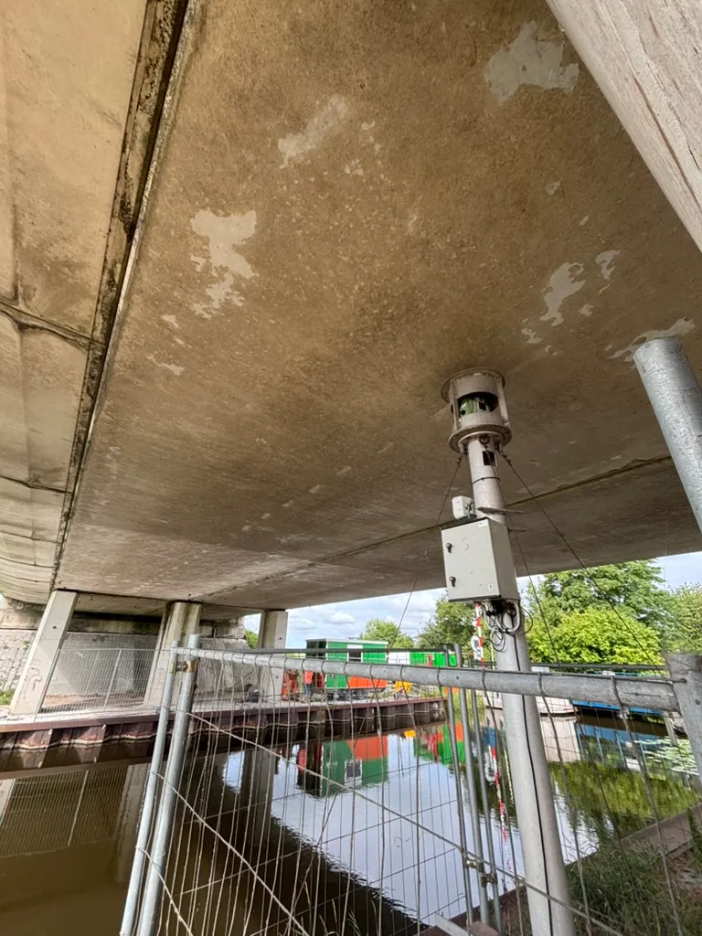 Monitoring equipment installed beneath a bridge