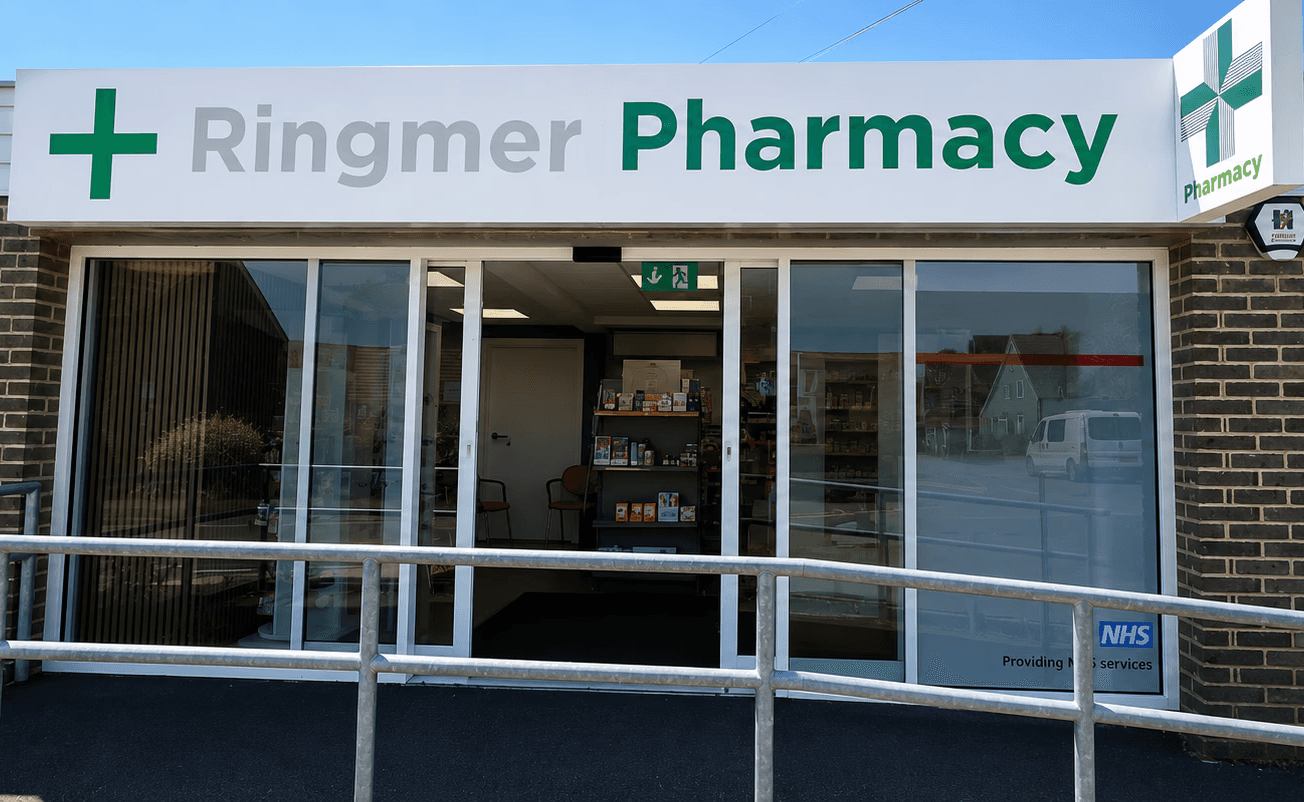 Pharmacist consulting with a patient in a private clinic room
