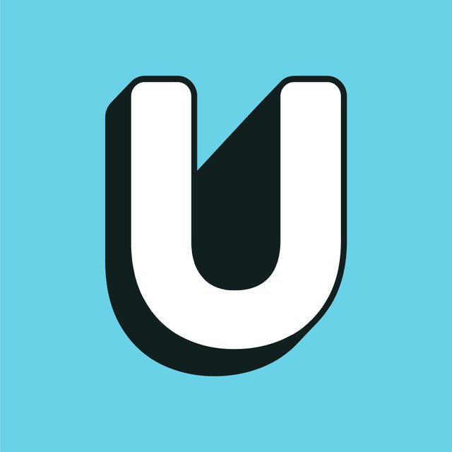 person in red sweater holding babys hand