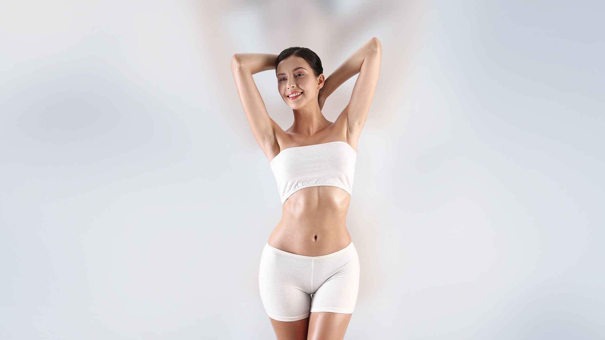 Image showcasing a happy woman after laser hair removal