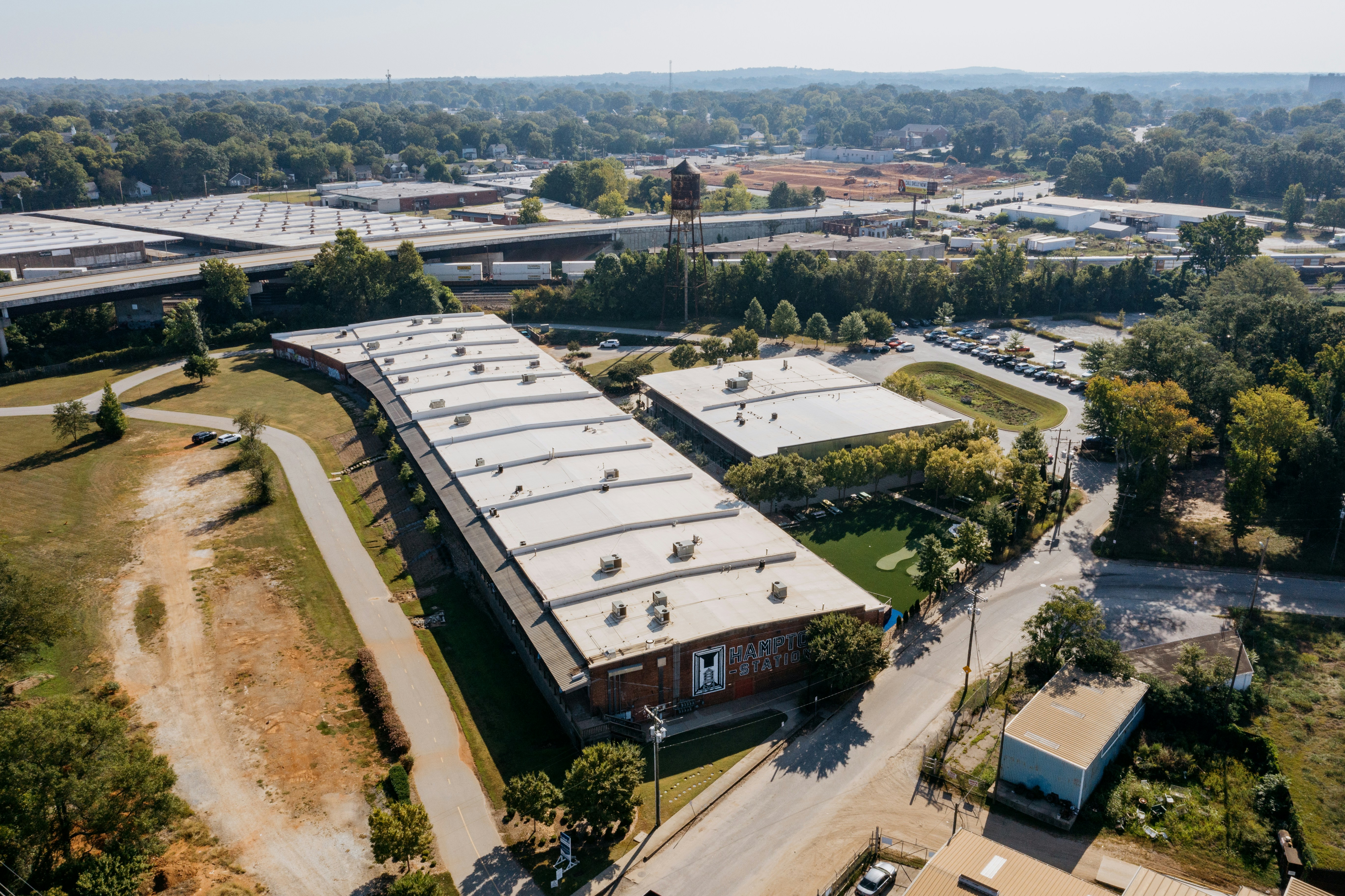 Aerial view of a long, modern industrial building complex.