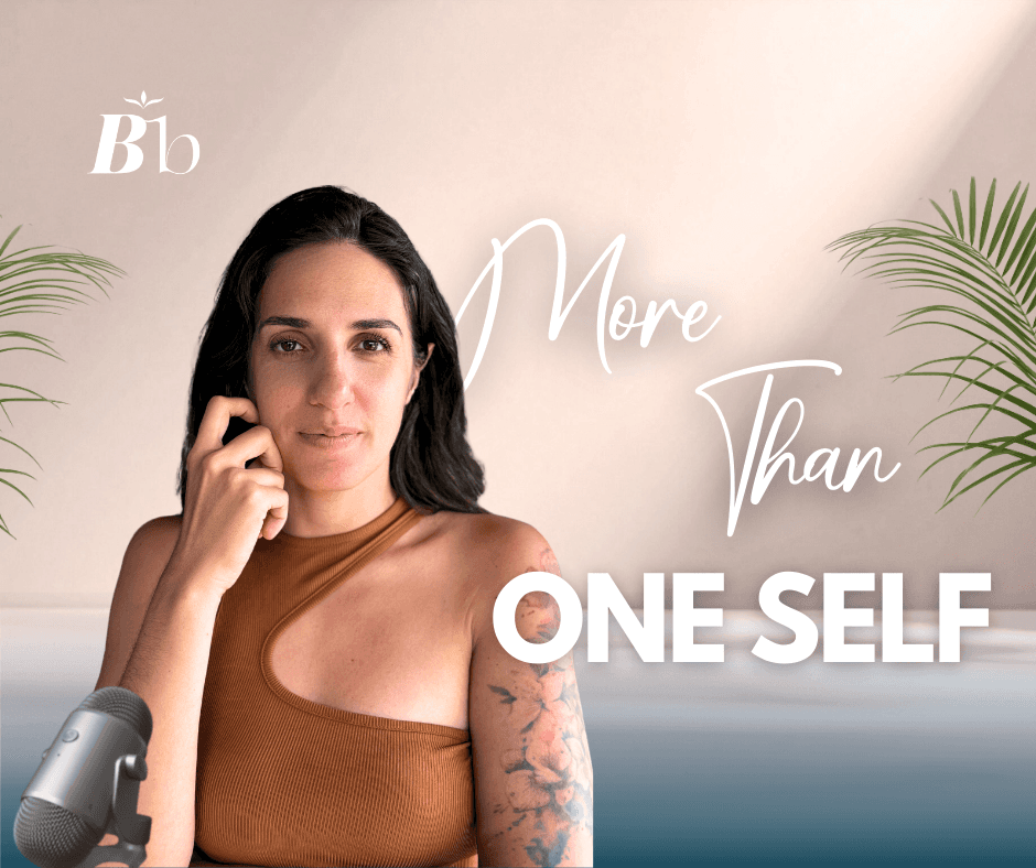 A woman is standing, looking self condifent, staring at the camera with her hand gently touching her cheek. The caption reads "More Than One Self"