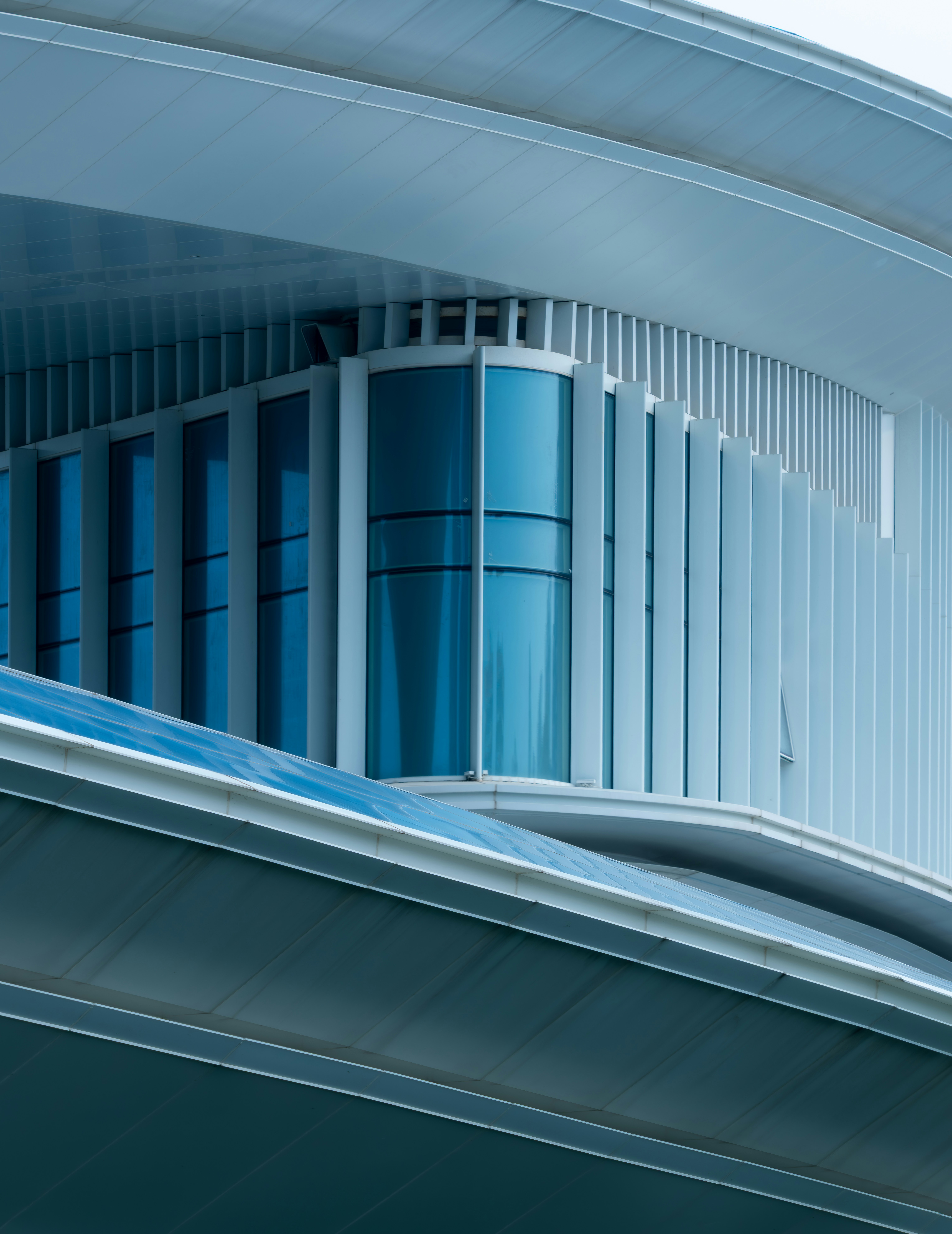 Modern architectural details with glass and white fins