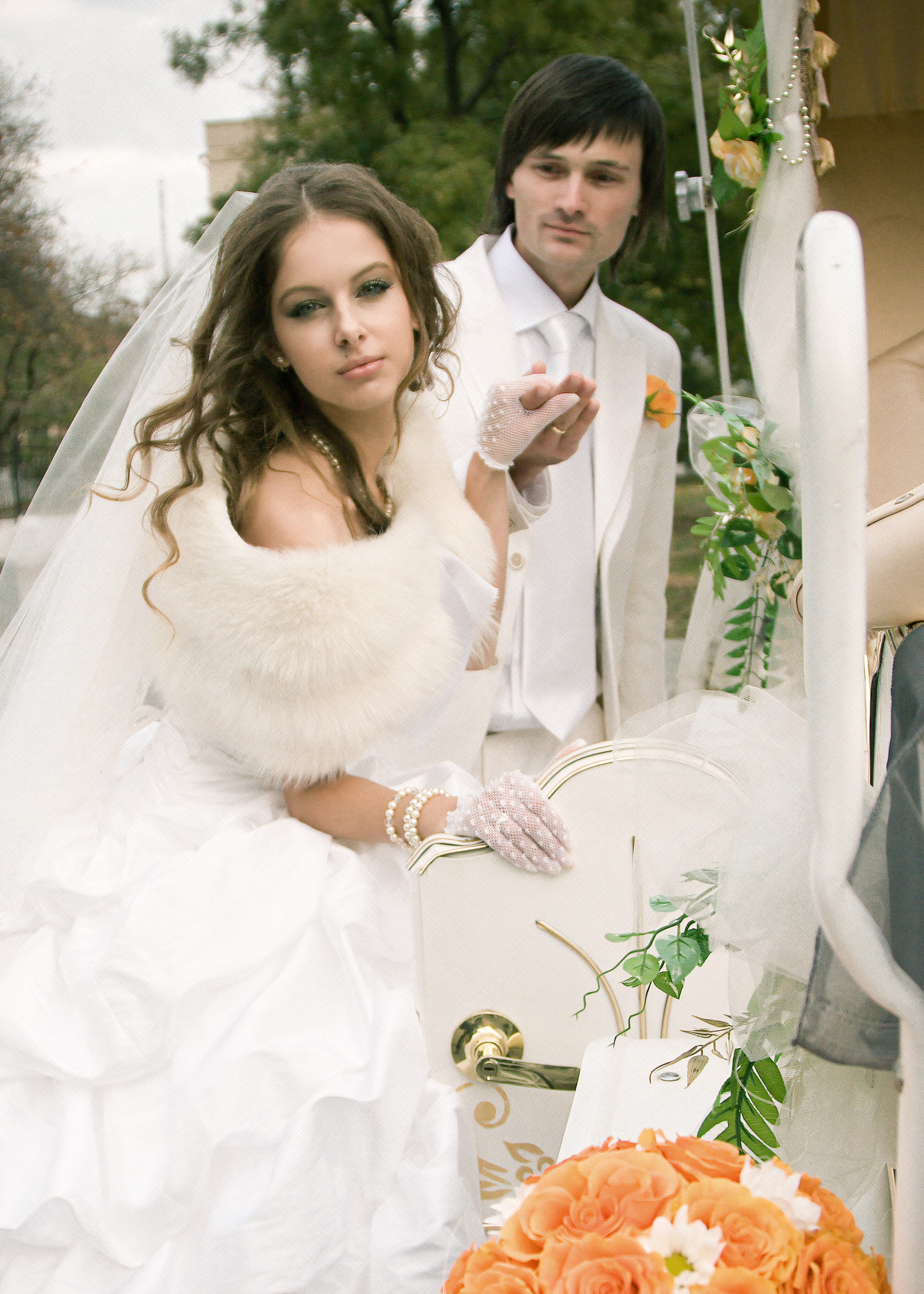 Bride and groom posing in a styled horse carriage during a romantic editorial wedding portrait, featuring elegant composition, refined details, and advanced posing direction by an Atlanta wedding photographer