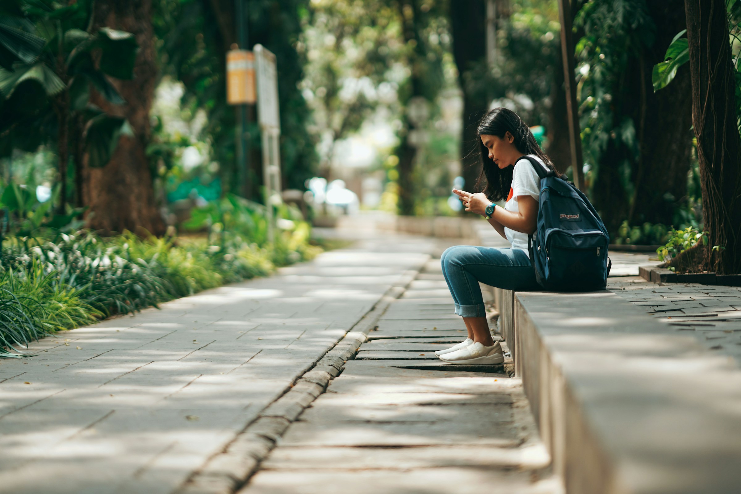 woman looking at her new videos - How To Make Your TikTok Video Go Viral After Posting