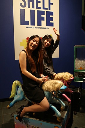 two women riding fake horse