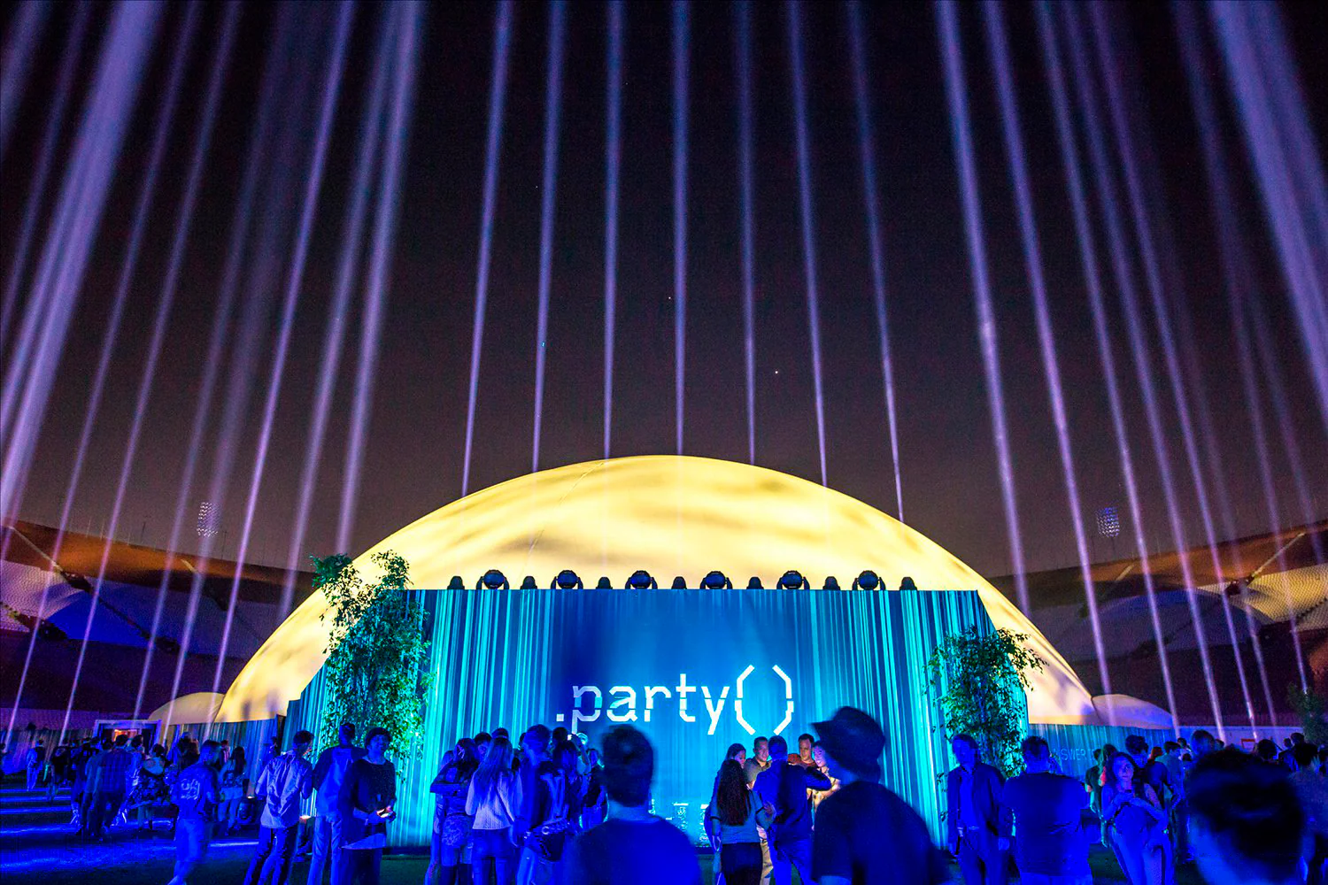 Inflatable Moon that is lit up in festival grounds