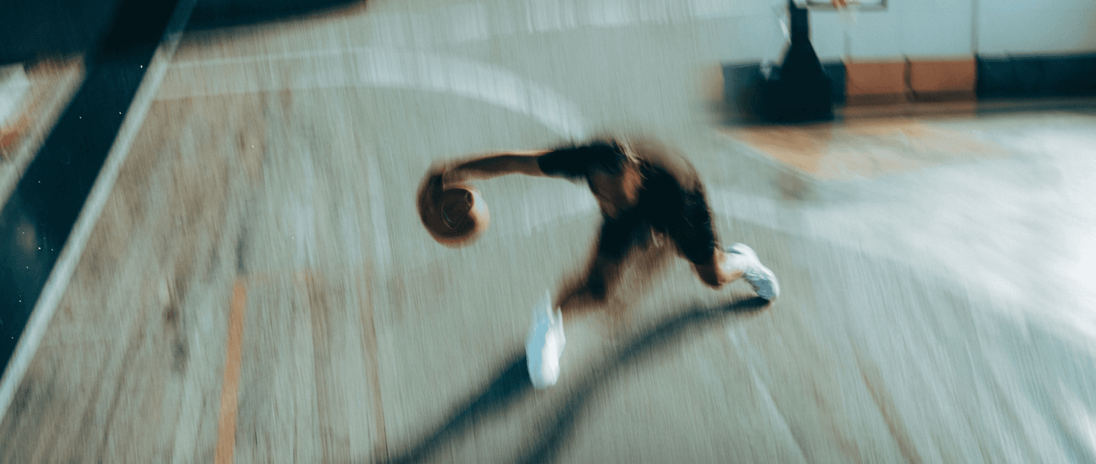 street with many ads for the pizza place and a person walking by