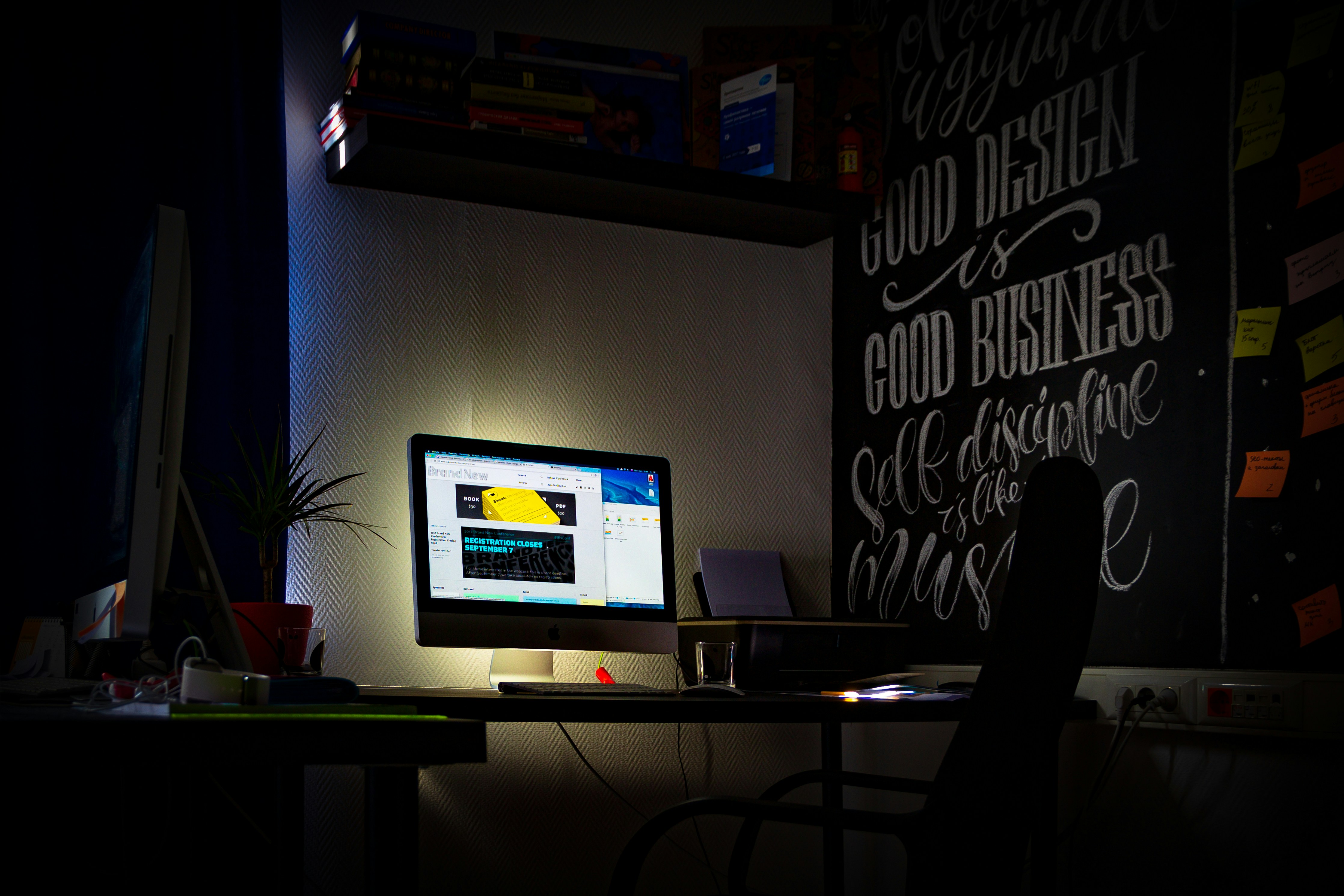 a computer monitor sitting on top of a desk