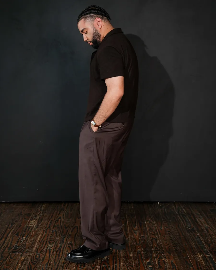 2AM in profile, looking down, studio portrait