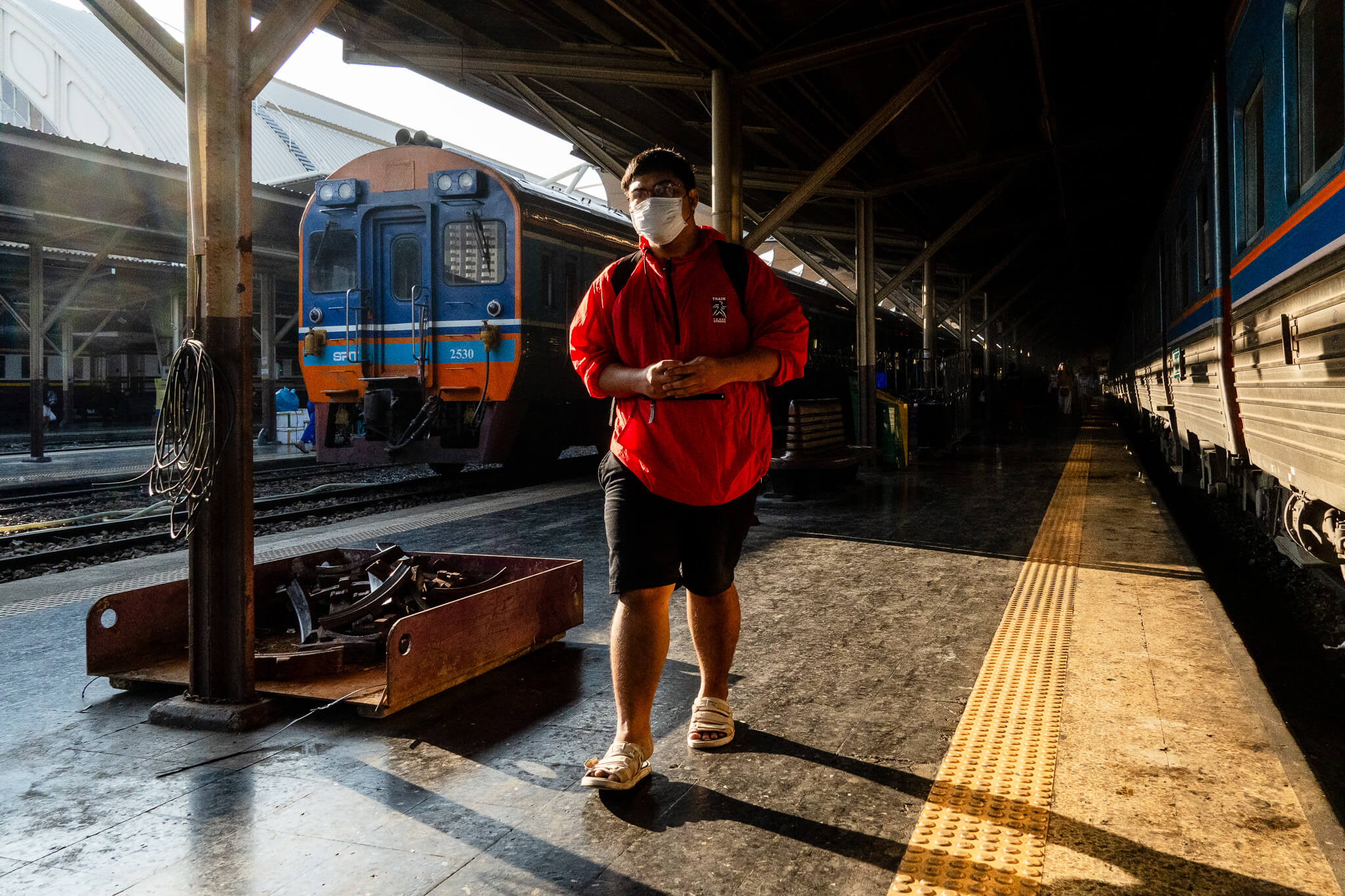 A man walking at Bangkok's train station