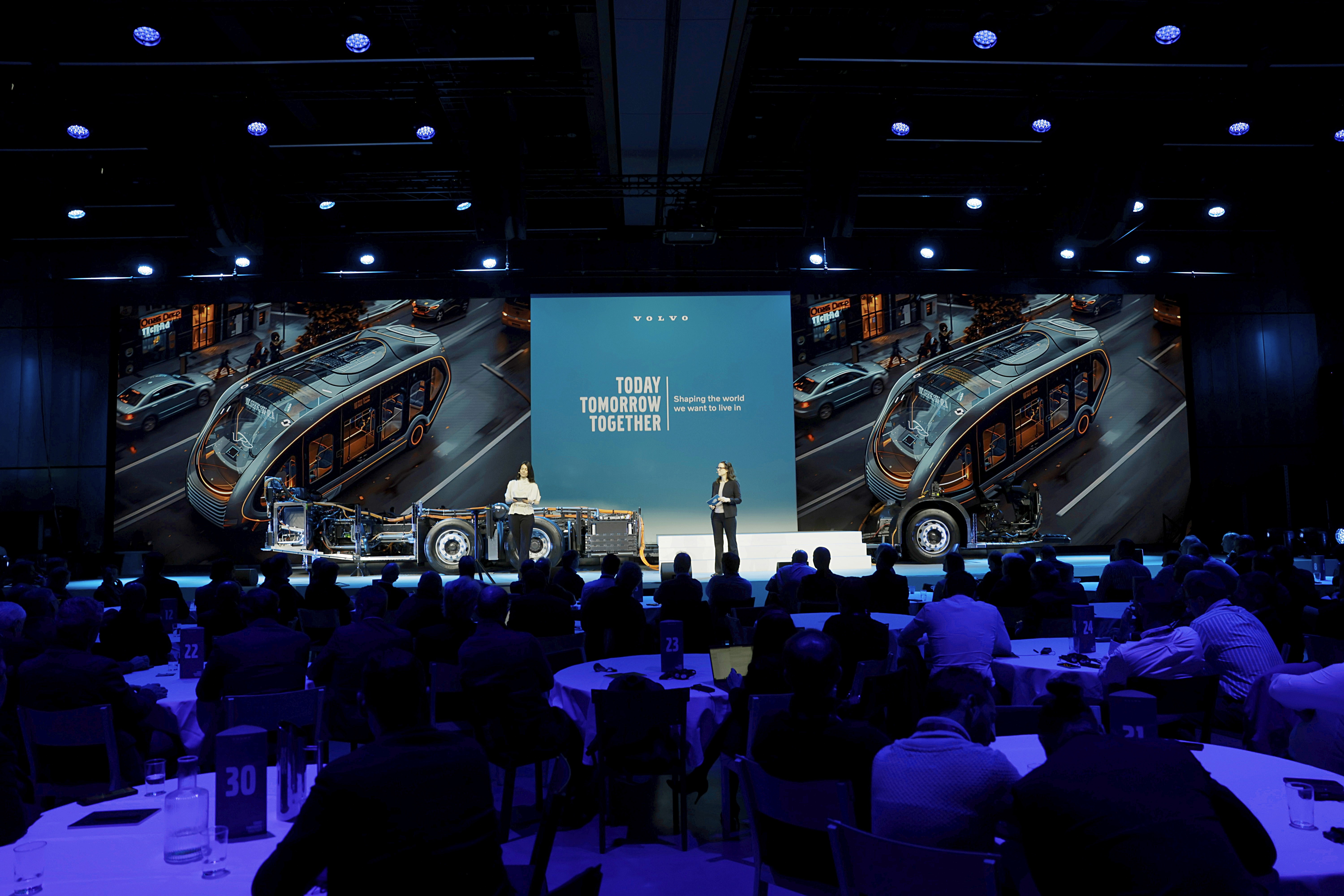 A four people pannel sitting in chairs on a stage