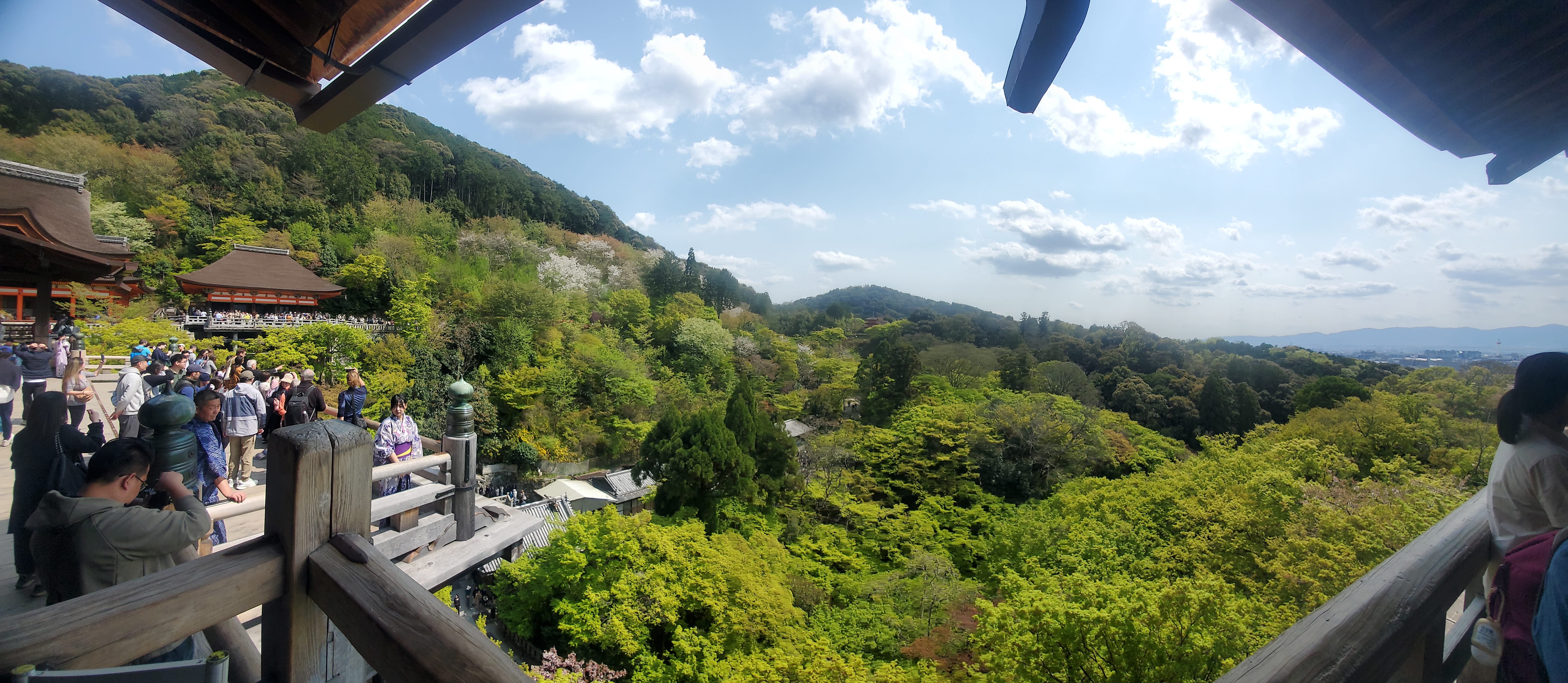 a group of people walking on a sidewalk