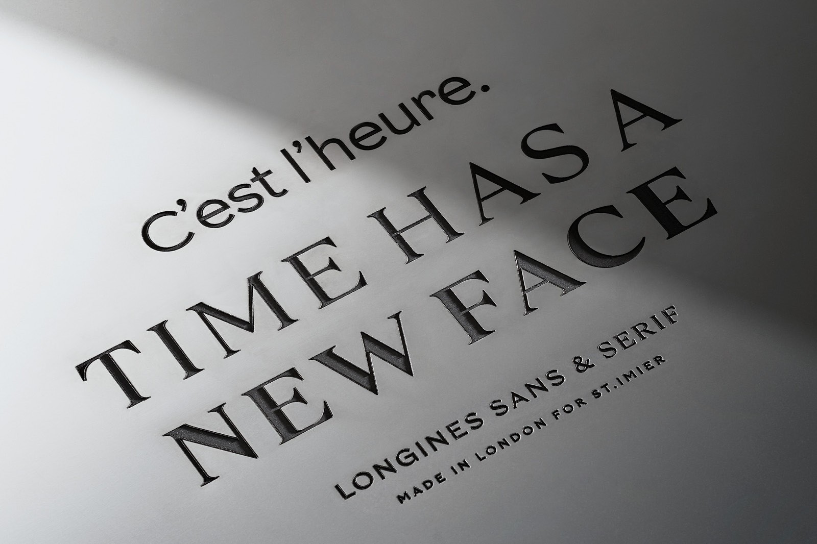 Text on a surface reads: "TIME HAS A NEW FACE" in bold, with a shadow creating a dramatic effect.