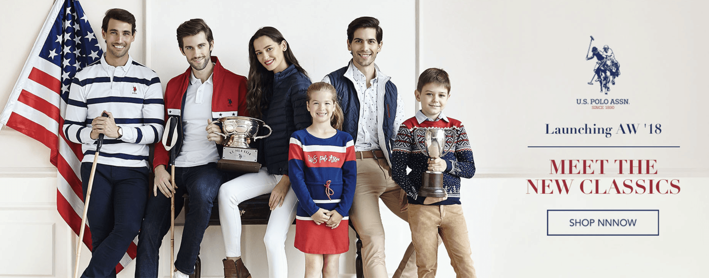 People playing soccer on a rooftop court surrounded by city buildings