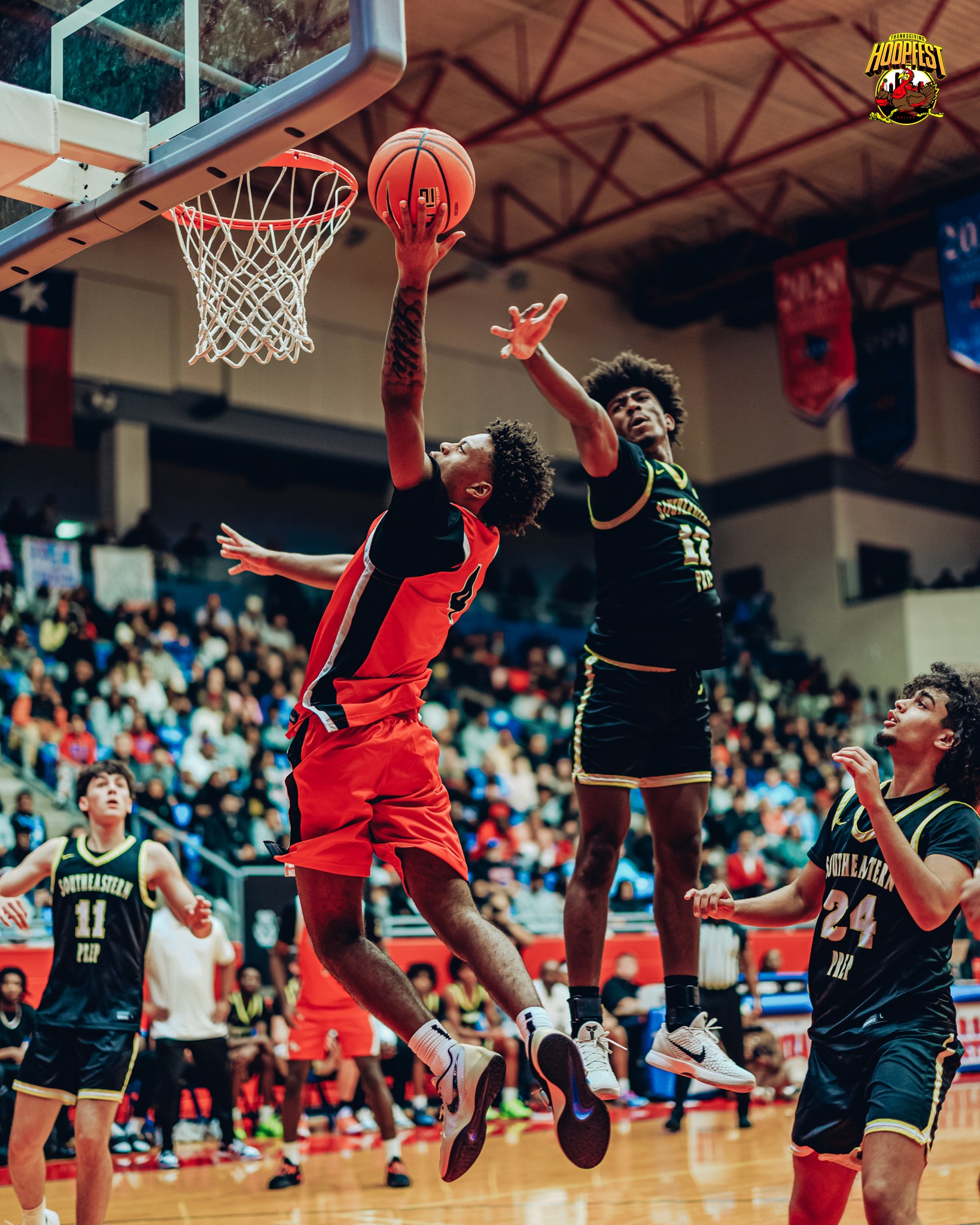 Three people sitting on a couch in a room looking at mobile devices