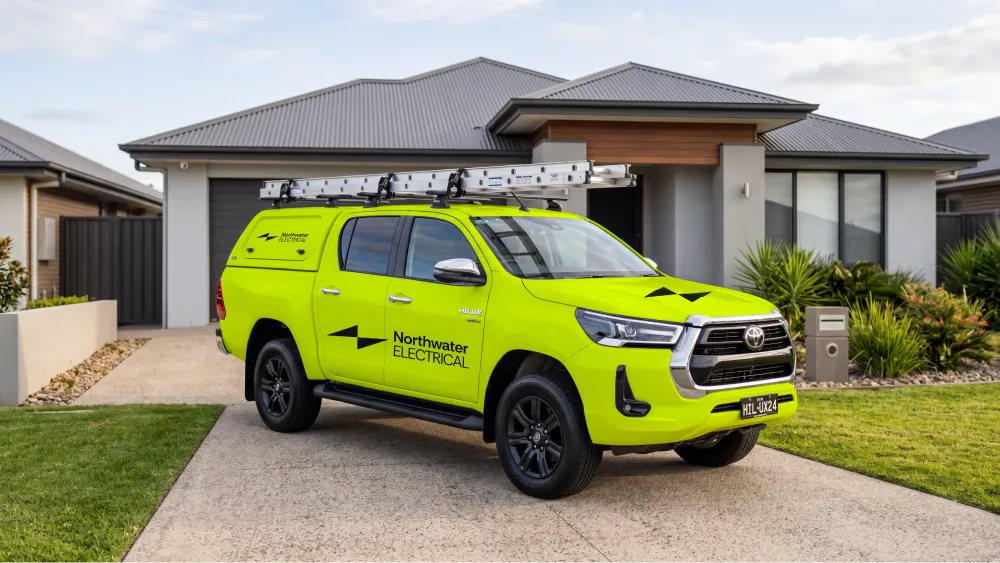 yellow northwater vehicle wrap on hliux