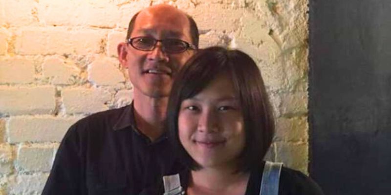Sukee and her father inside their family business restaurant.