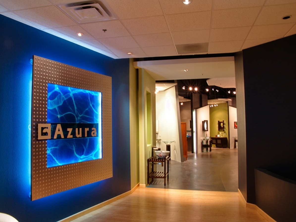 Contemporary lobby with blue illuminated Azura sign; Scottsdale architect design.