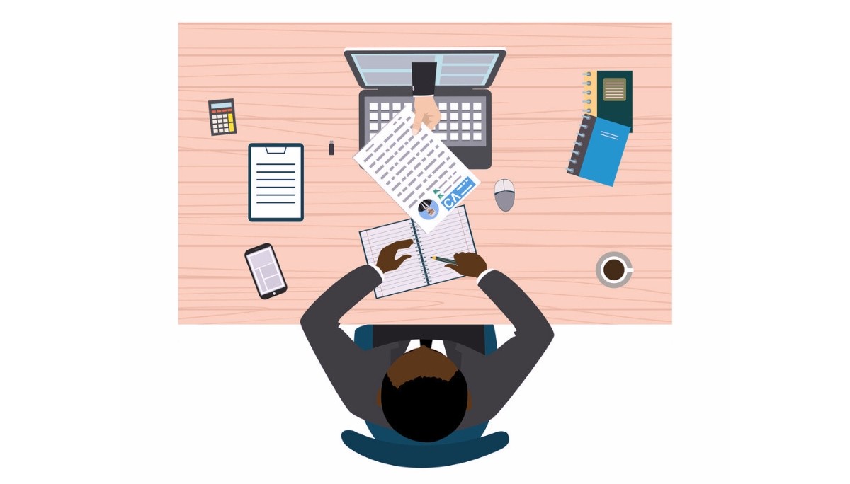 Top‑down illustration of a workspace where one person writes in a notebook while another hand passes over a CV, surrounded by items like a laptop, calculator, phone, coffee, and office supplies.