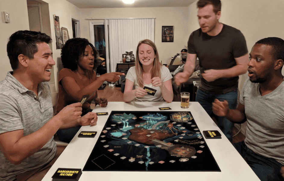 5 friends playing a board game in relaxed settings.