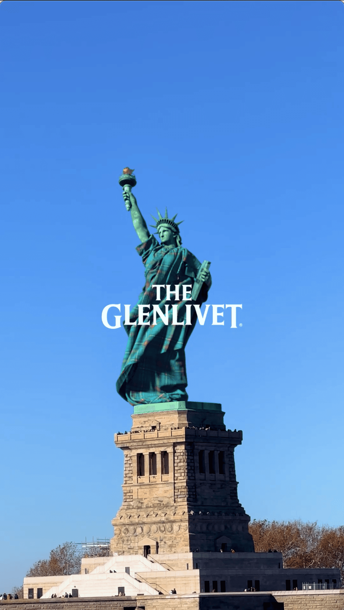 The Statue of Liberty with "The Glenlivet" logo superimposed over the center