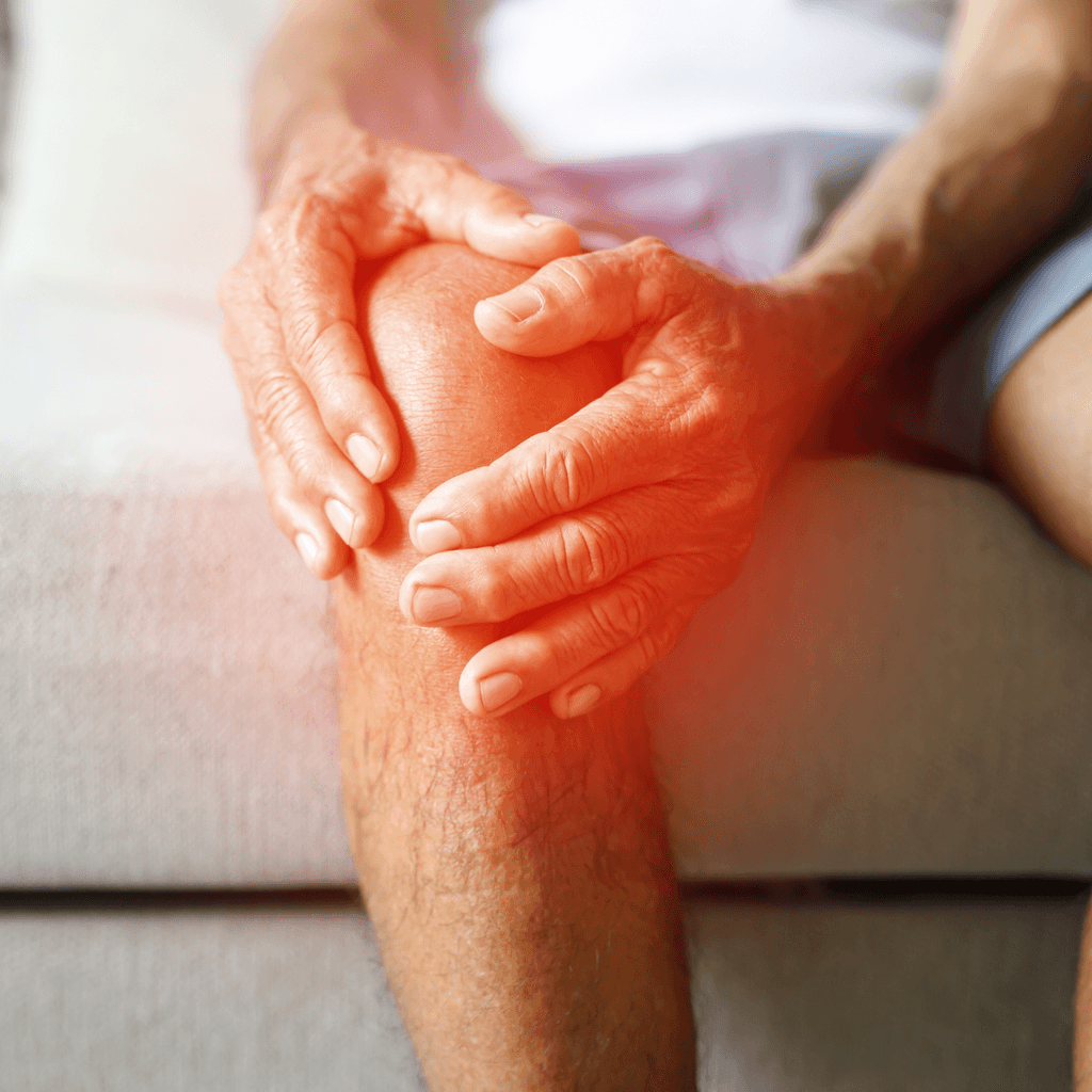 Man holding inflamed painful knee