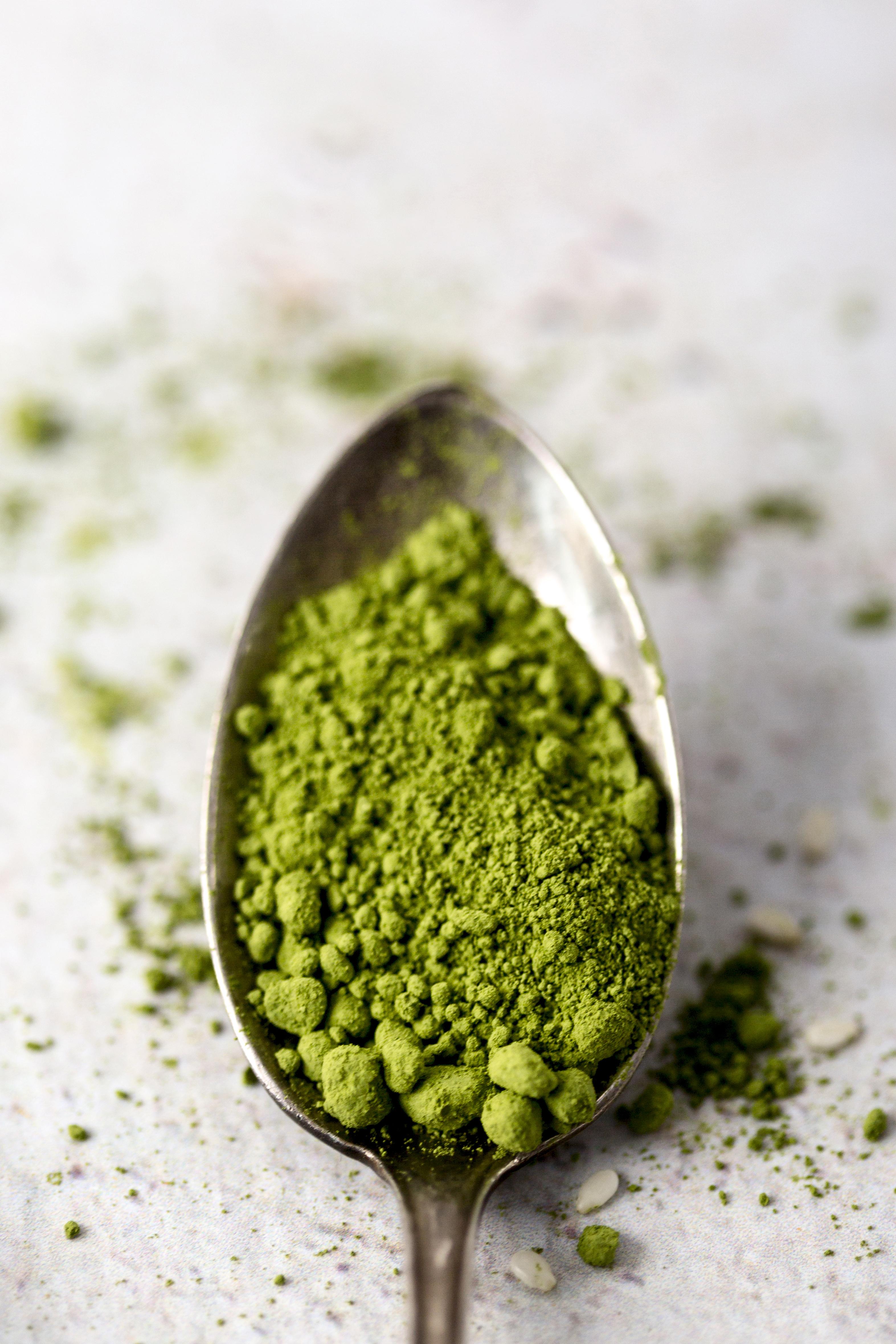 Image of Ashwagandha Roots with a Bottle in the Background