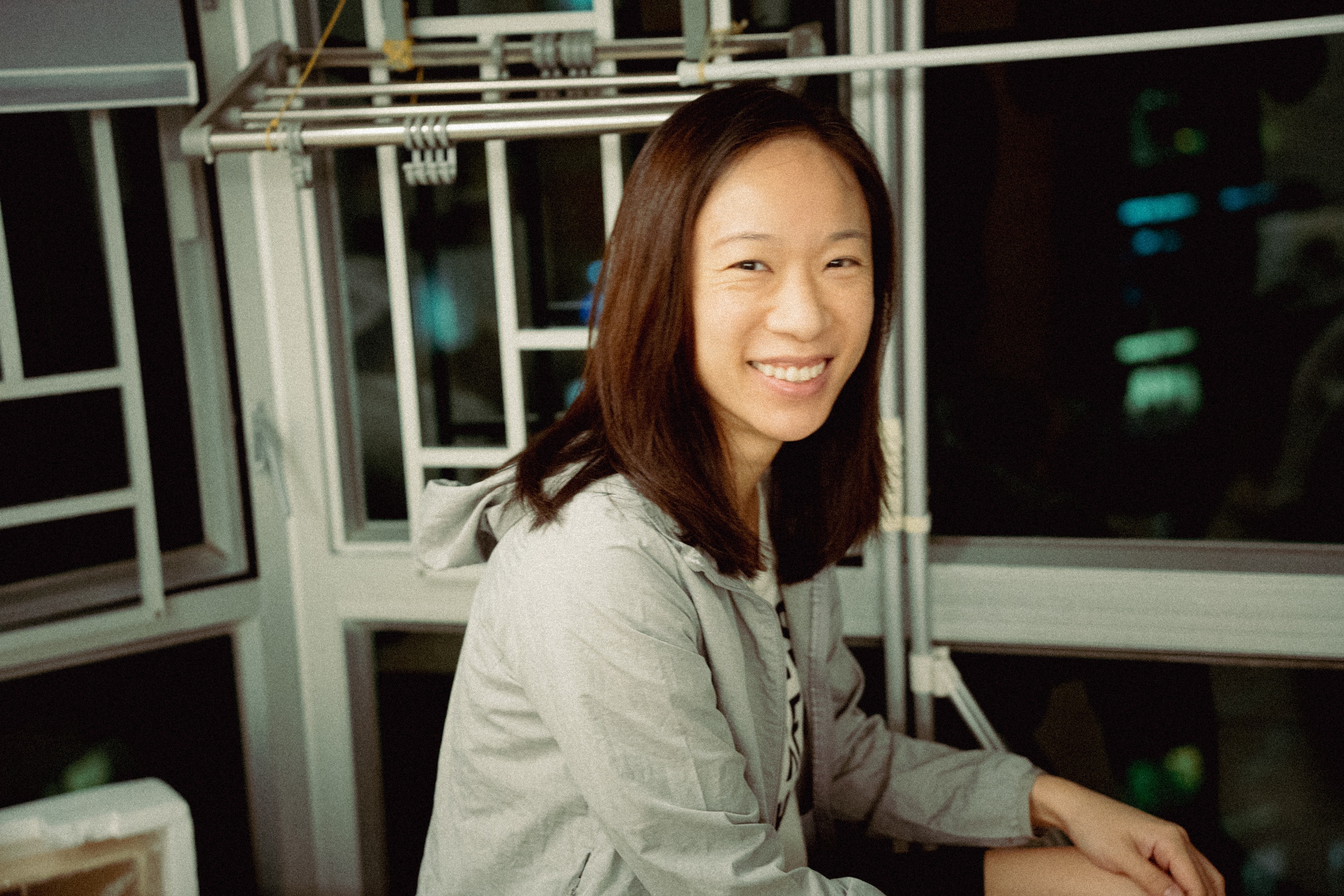 close up of the sister wearing her brother's jacket