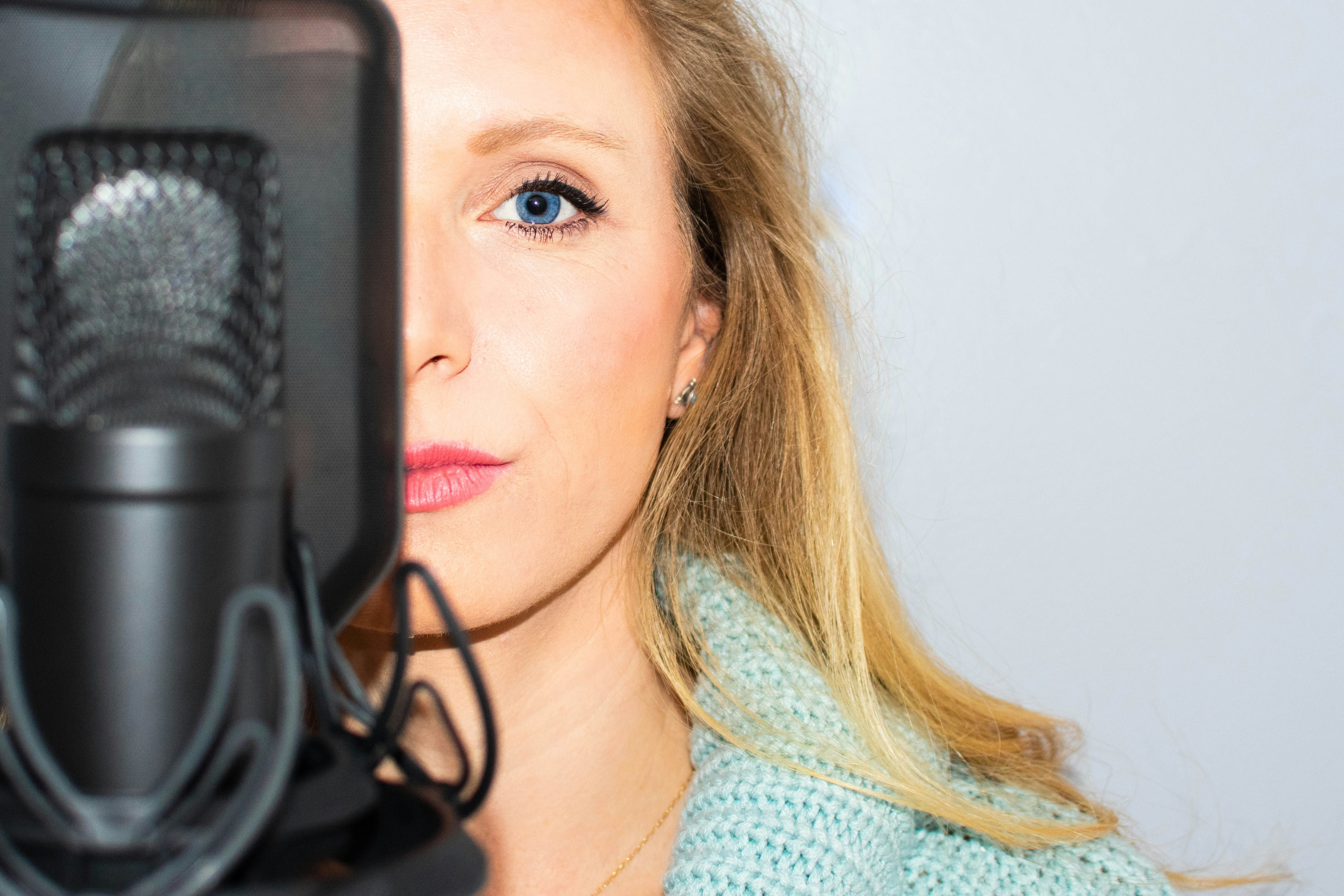 Woman standing infront of micrphone - ai vocals