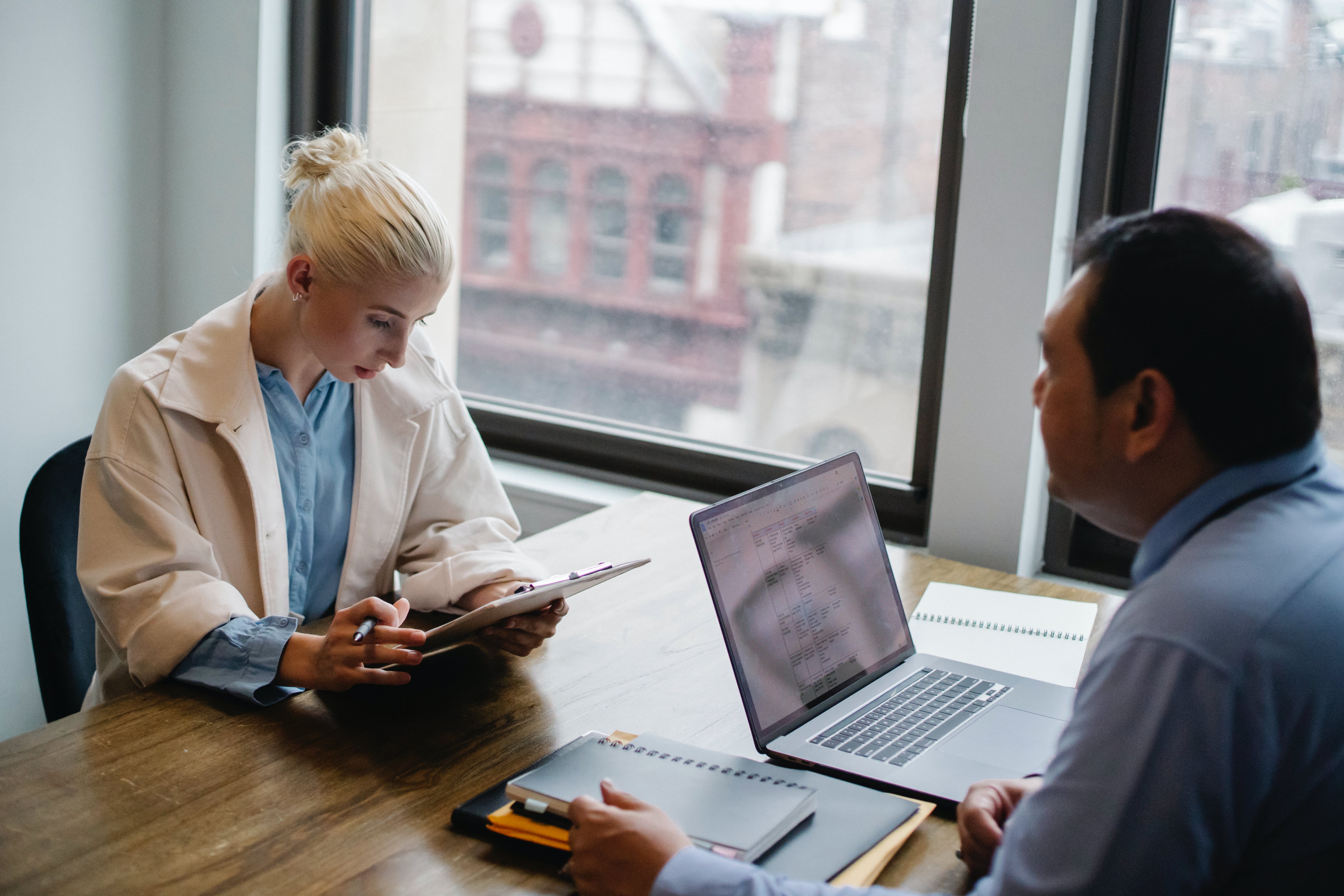 Young woman reading report about securing CEO emails