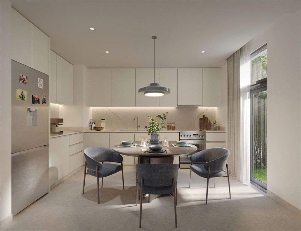 A kitchen featuring a dining table and chairs, set in Opal Gardens, showcasing a warm and inviting atmosphere.