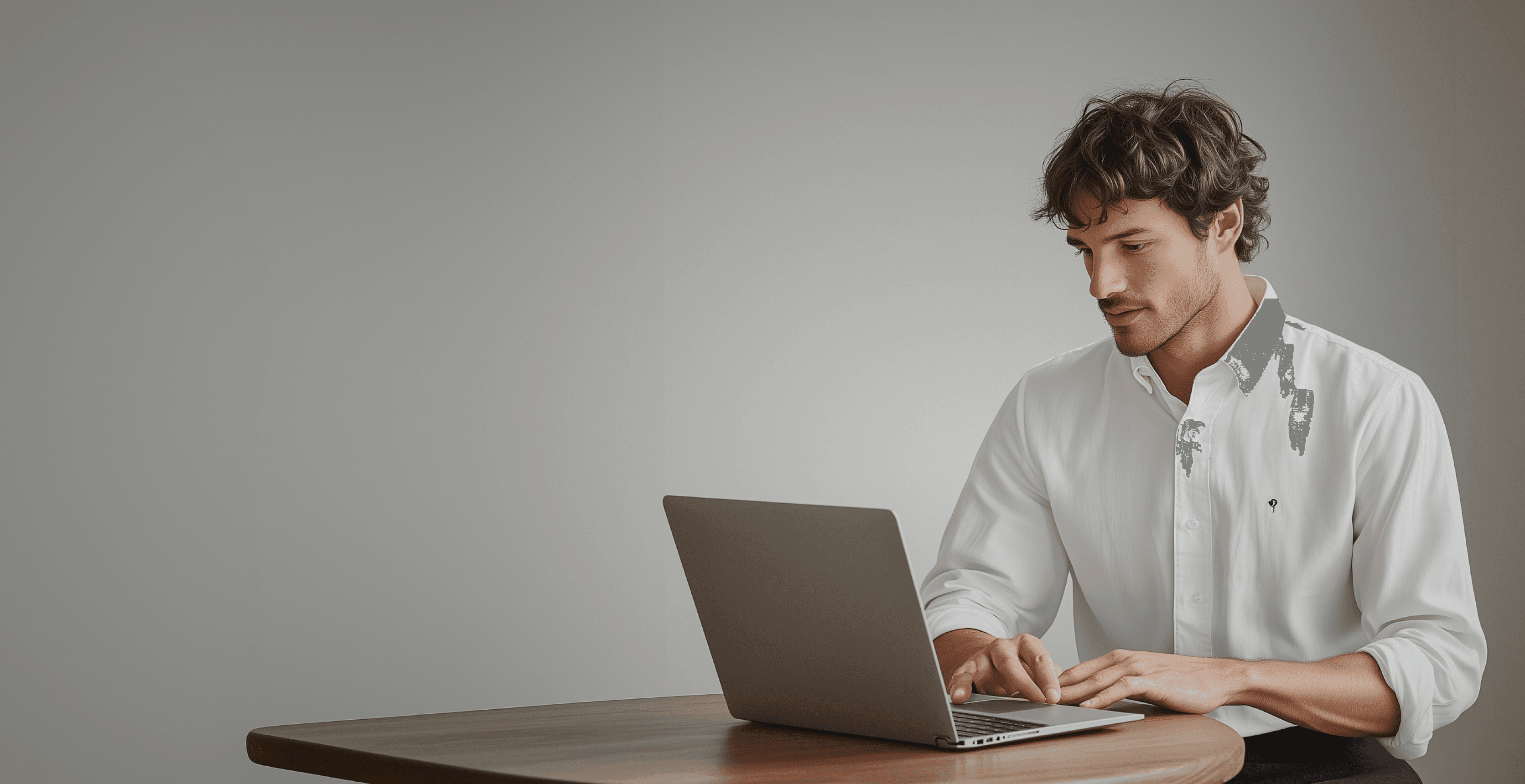 Man working on a laptop at a desk